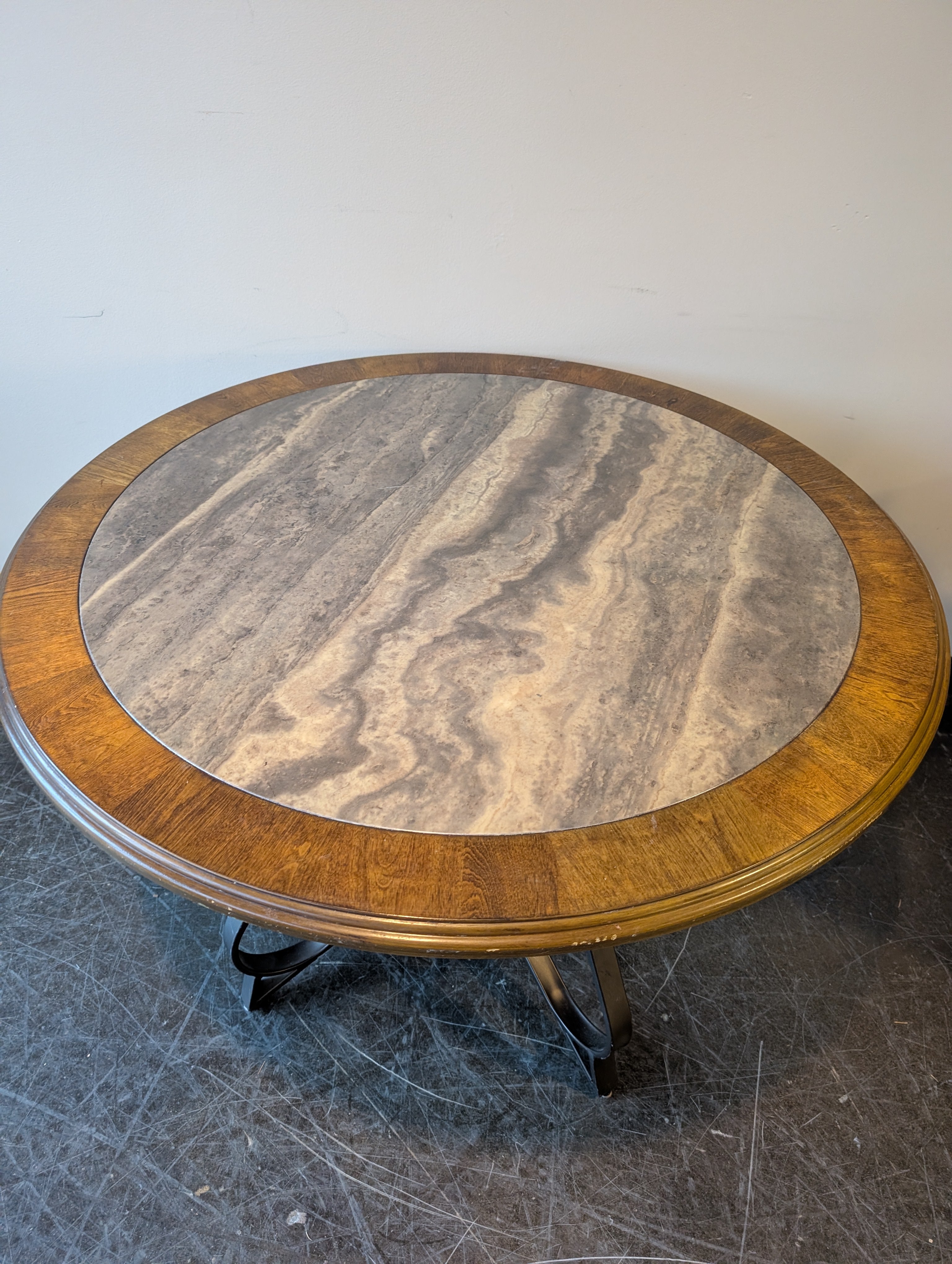 Round Stone Top Dining Table with Wood Trim and Metal Pedestal Base