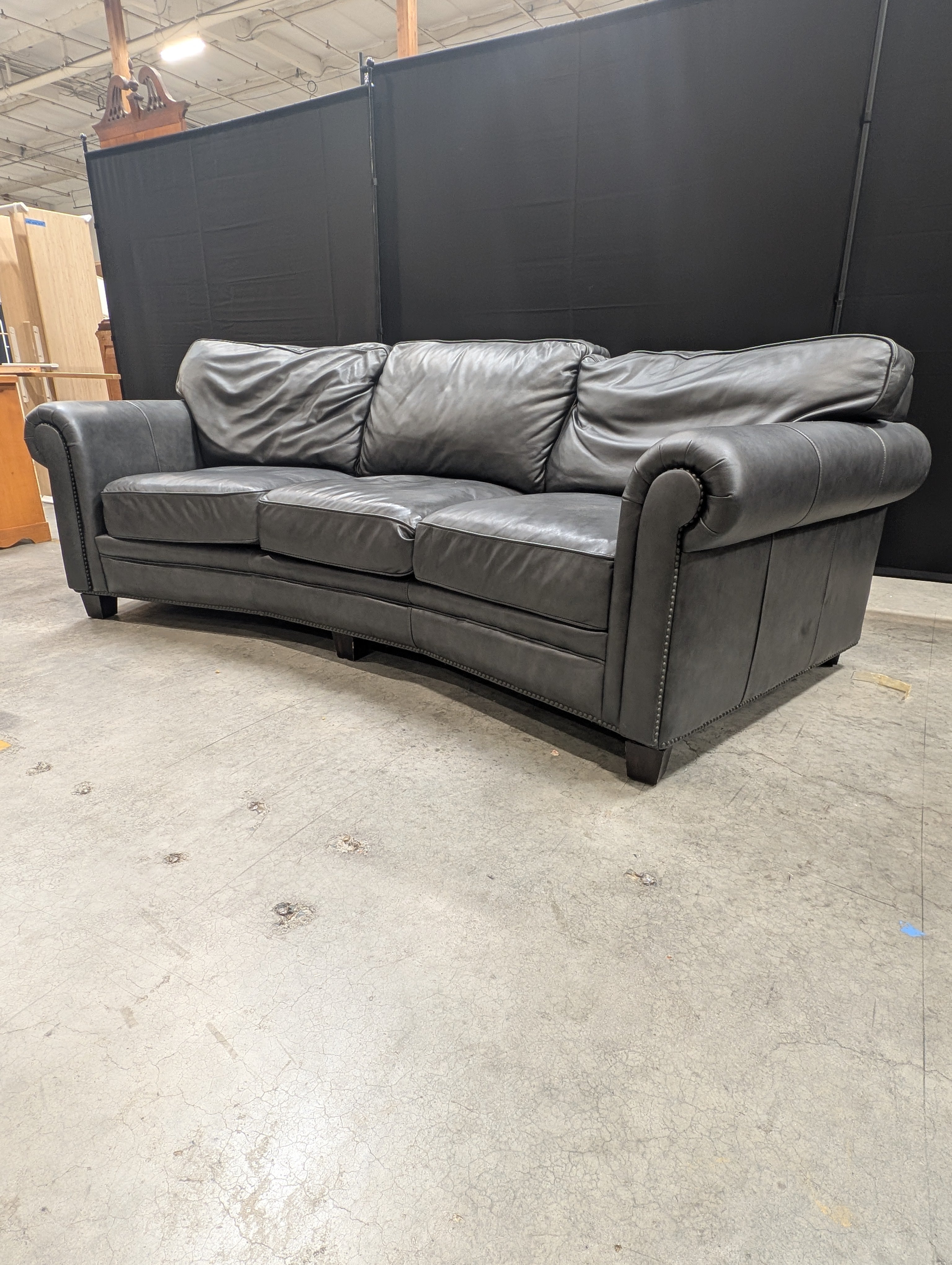 Curved Dark Grey Leather Three-Seater Sofa