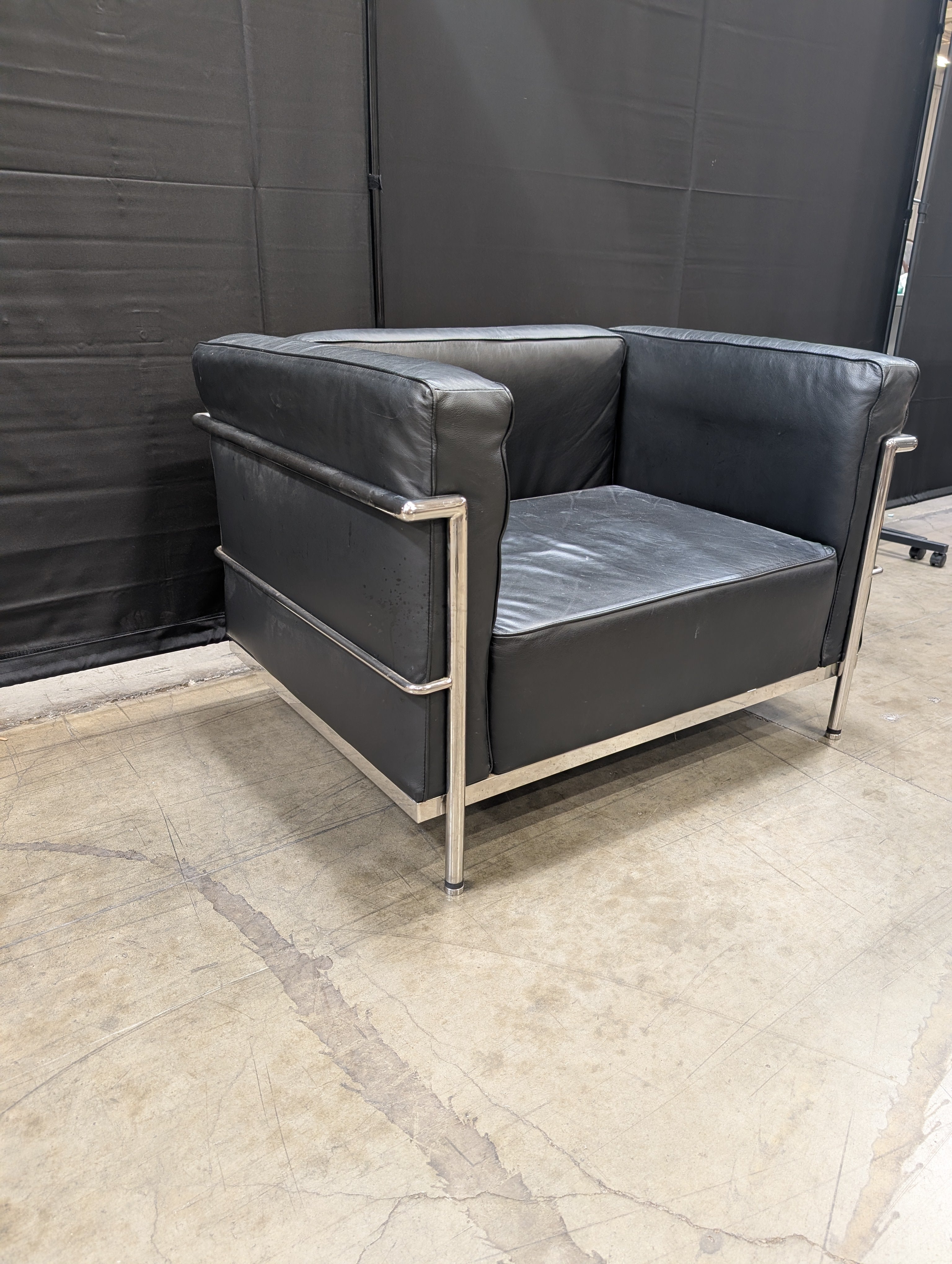 Modern Black Armchair with Polished Metal Frame