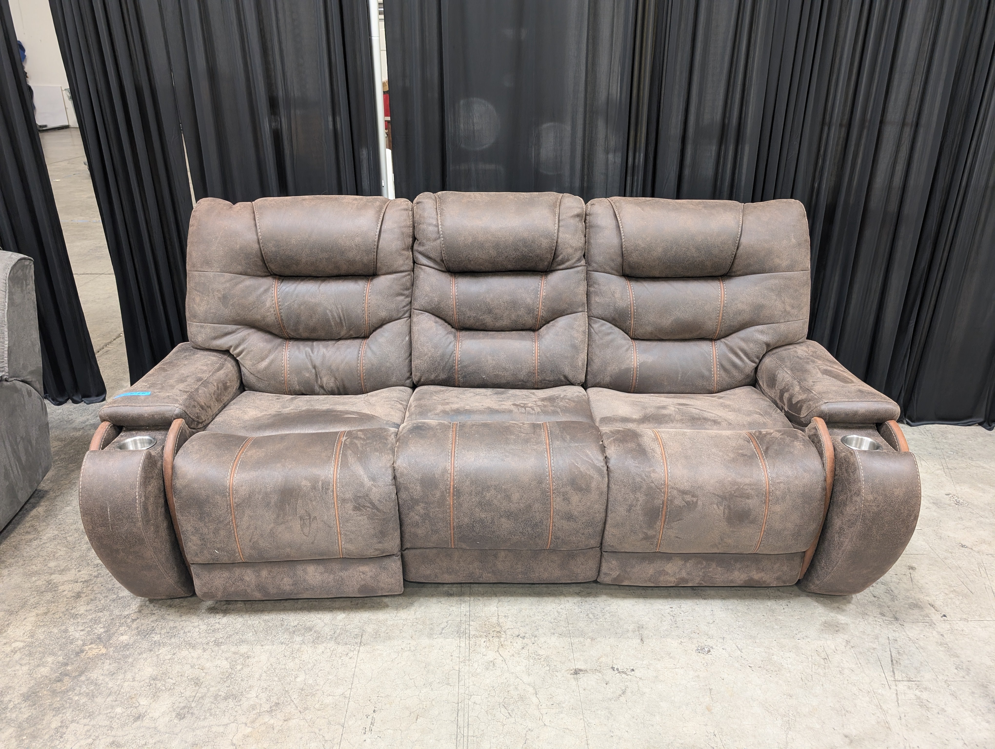 Distressed Brown Three-Seat Reclining Couch