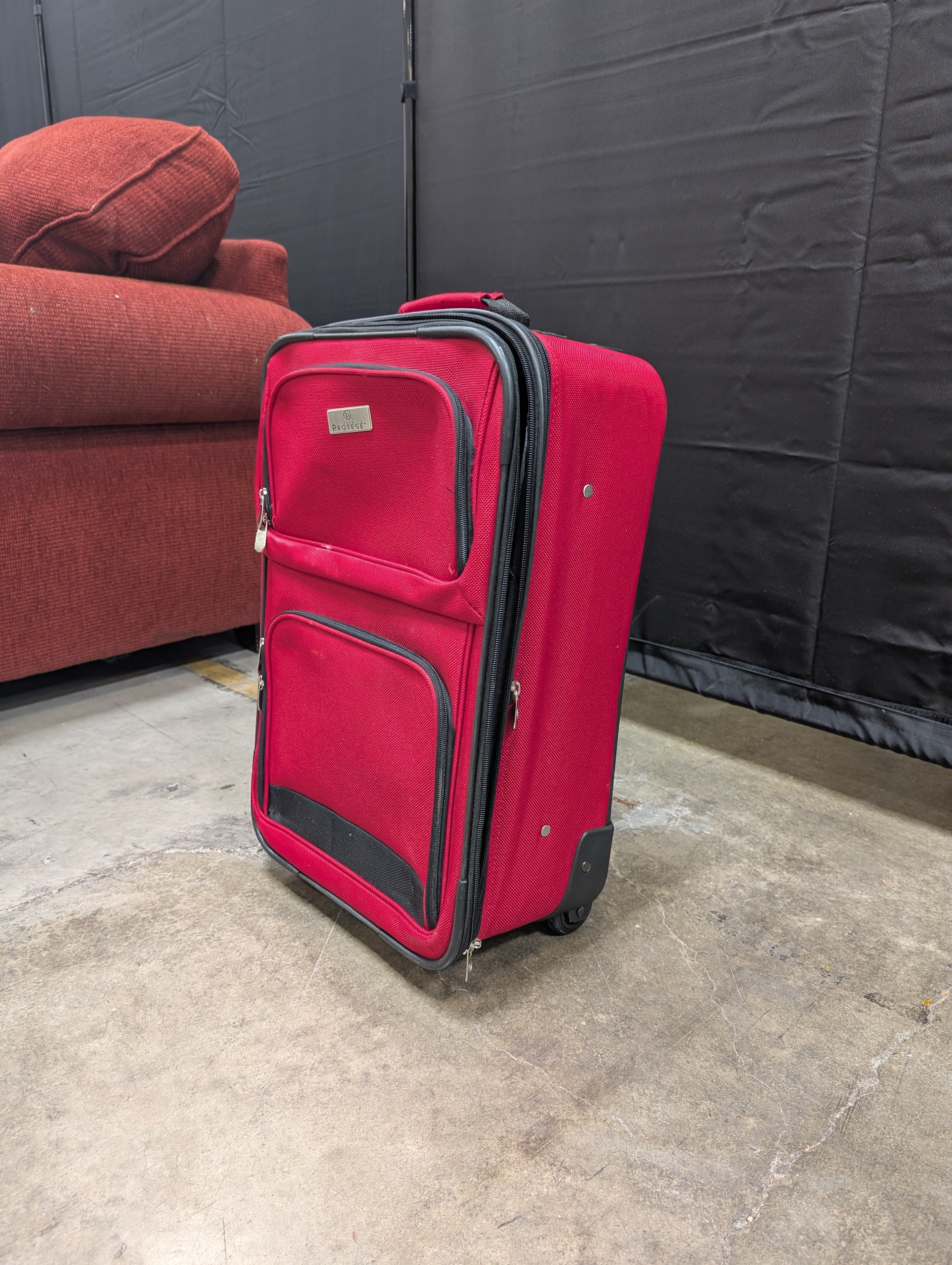 Red Softshell Rolling Suitcase with Exterior Pockets