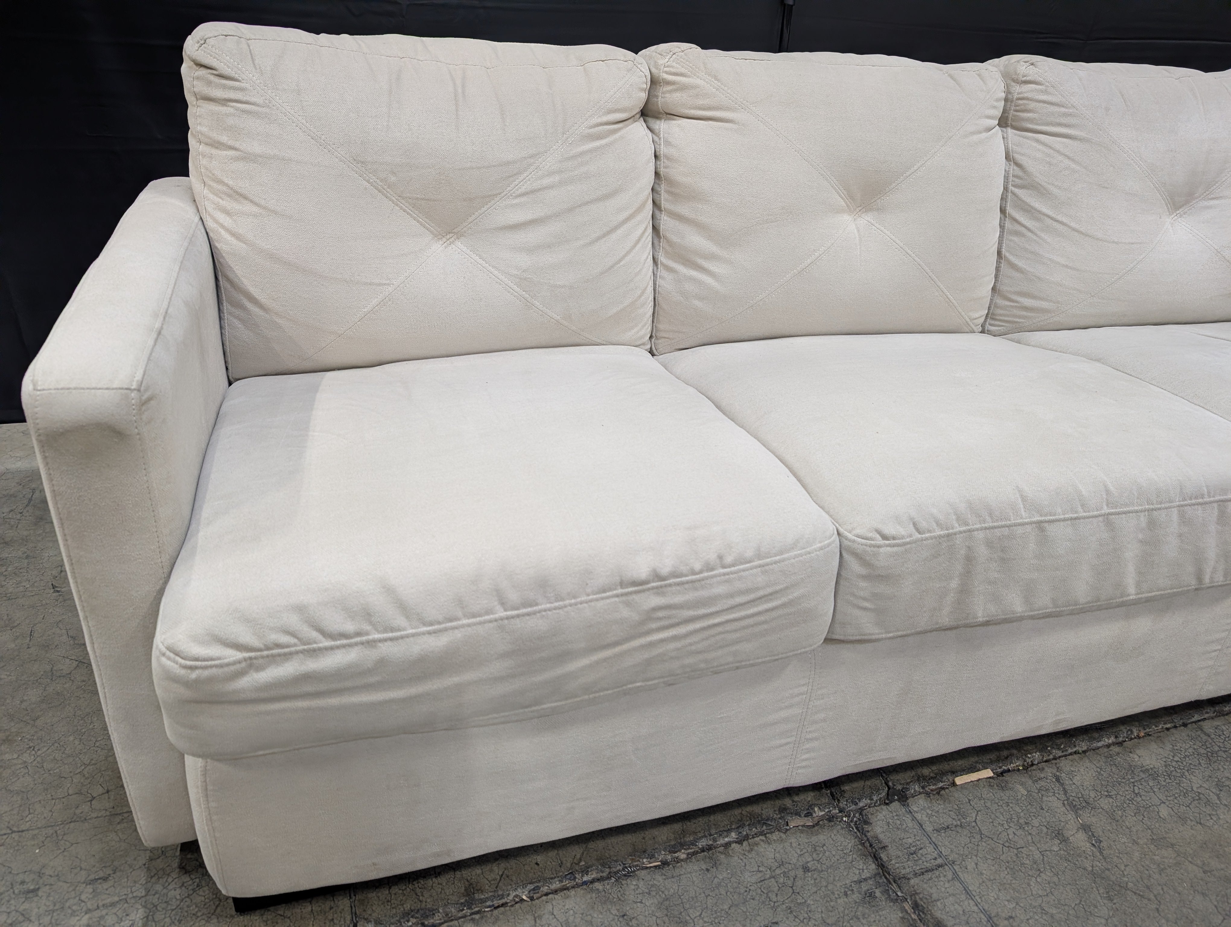 Spacious Light Beige Fabric Three-Seater Sofa
