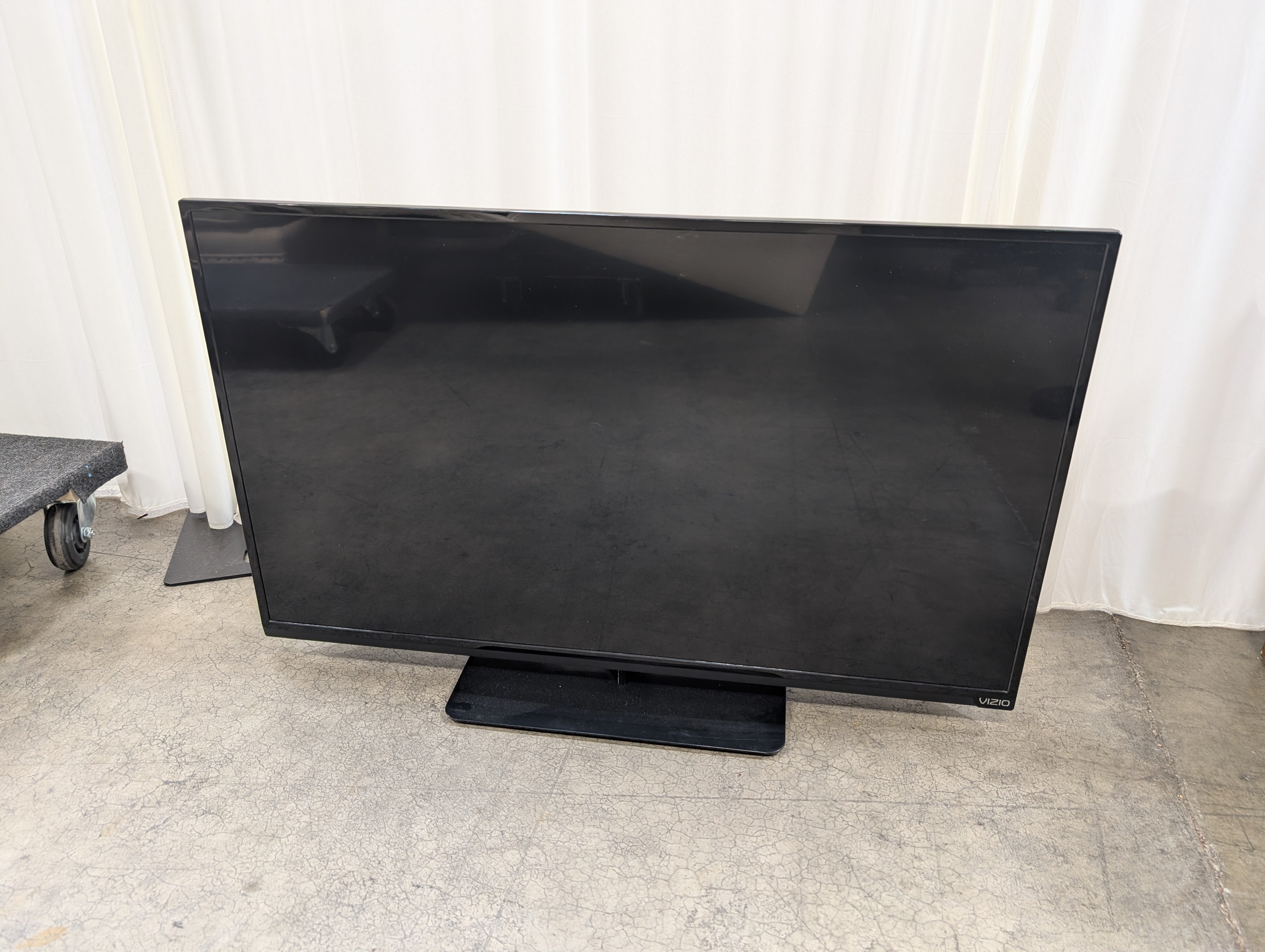 Black Flat Screen VIZIO TV with Stand