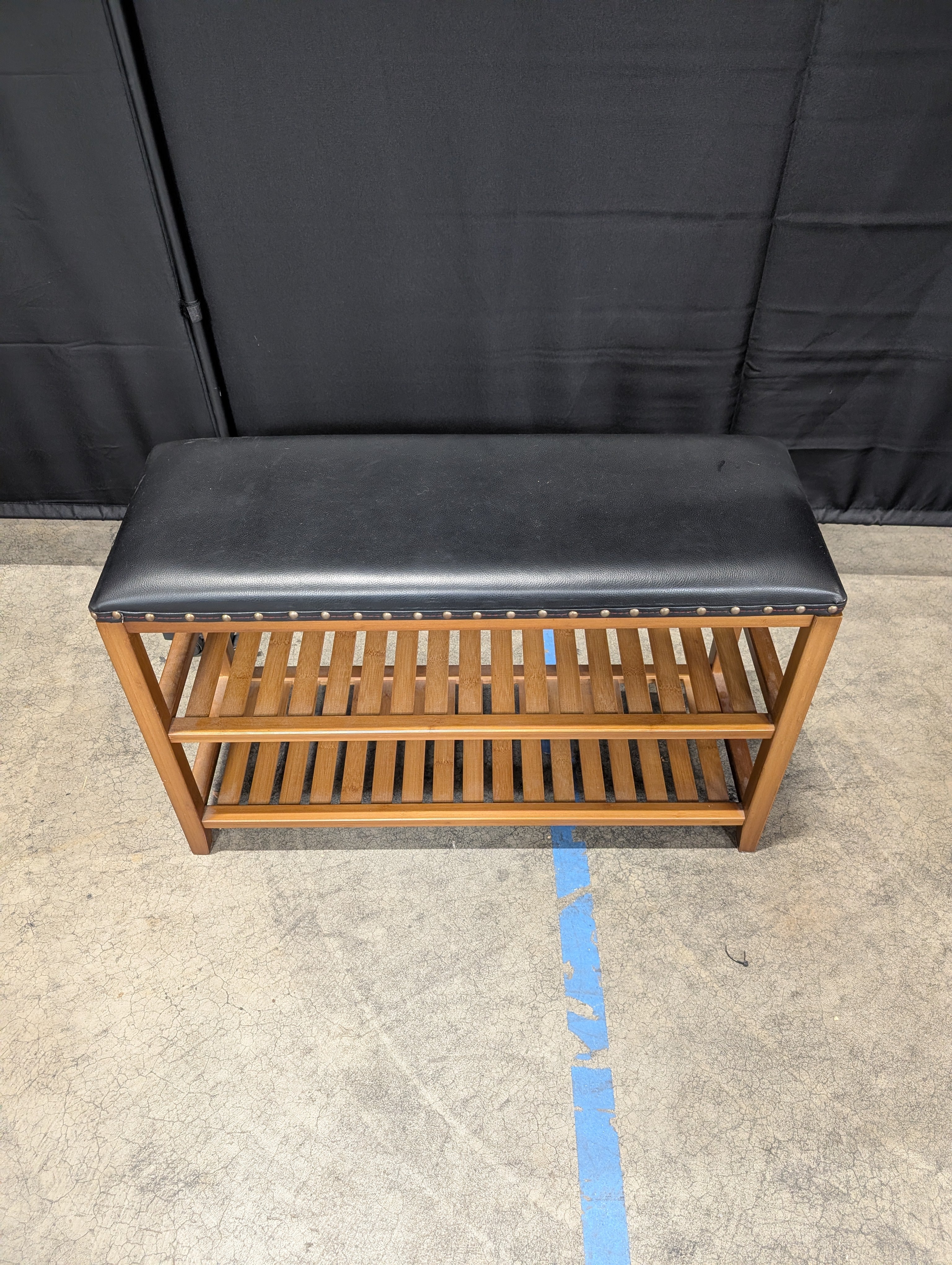 Hardwood Entryway Bench with Padded Black Upholstery and Slatted Shelves