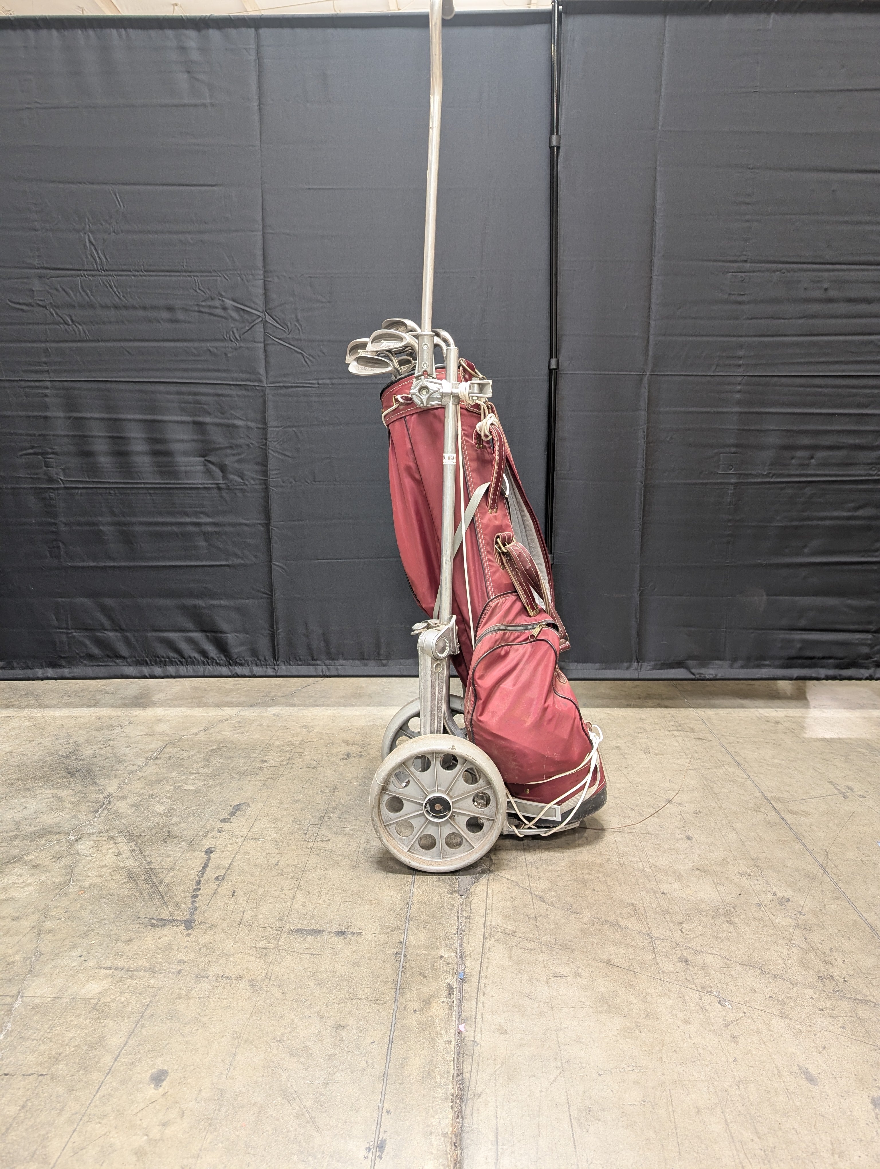 Set of Eleven Golf Clubs with Red Cart Bag and Push Cart