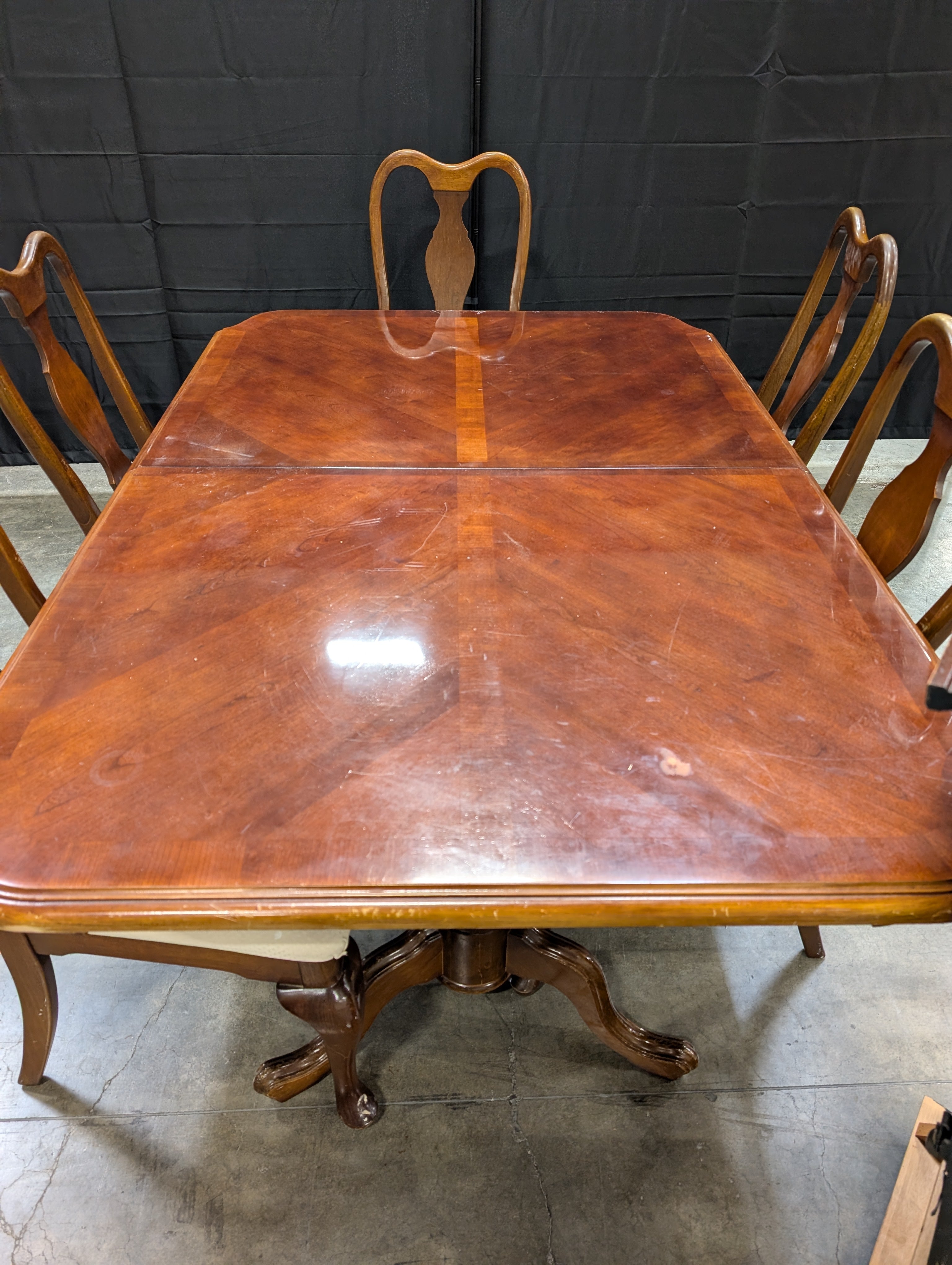 Traditional Dark Wood Dining Table with Six Shaped-Back Chairs