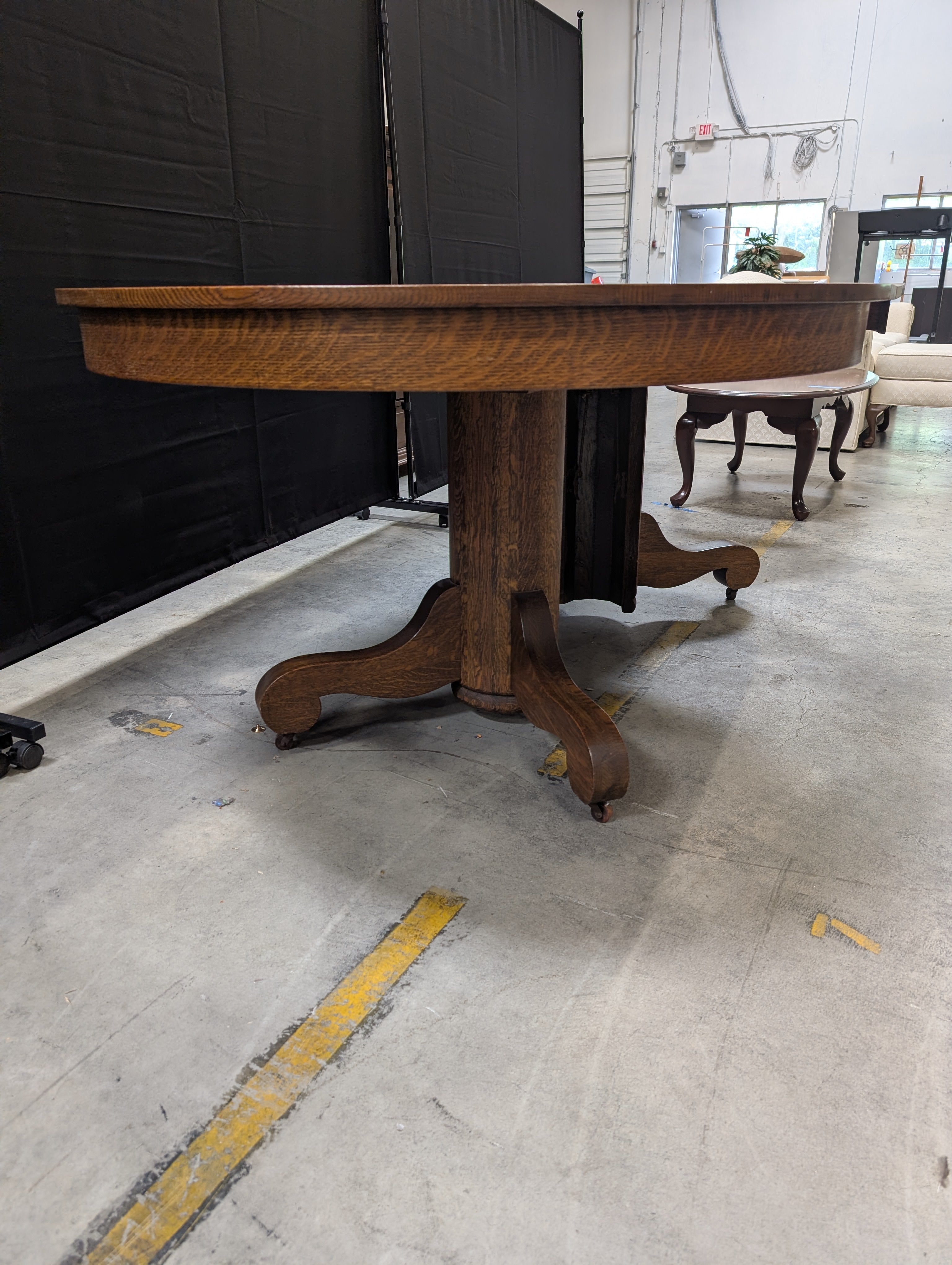 Round Dark Stained Wood Pedestal Dining Table