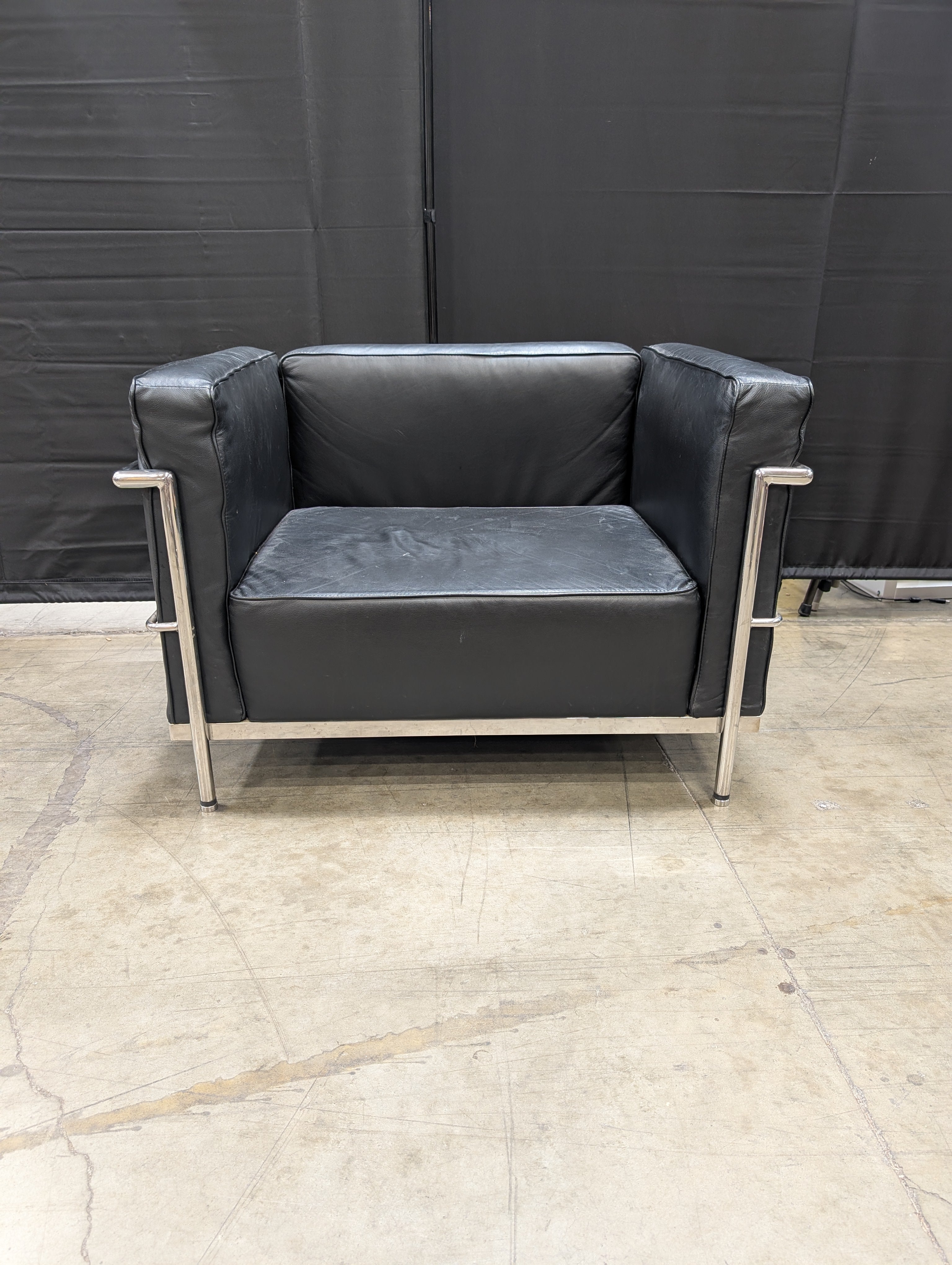 Modern Black Armchair with Polished Metal Frame