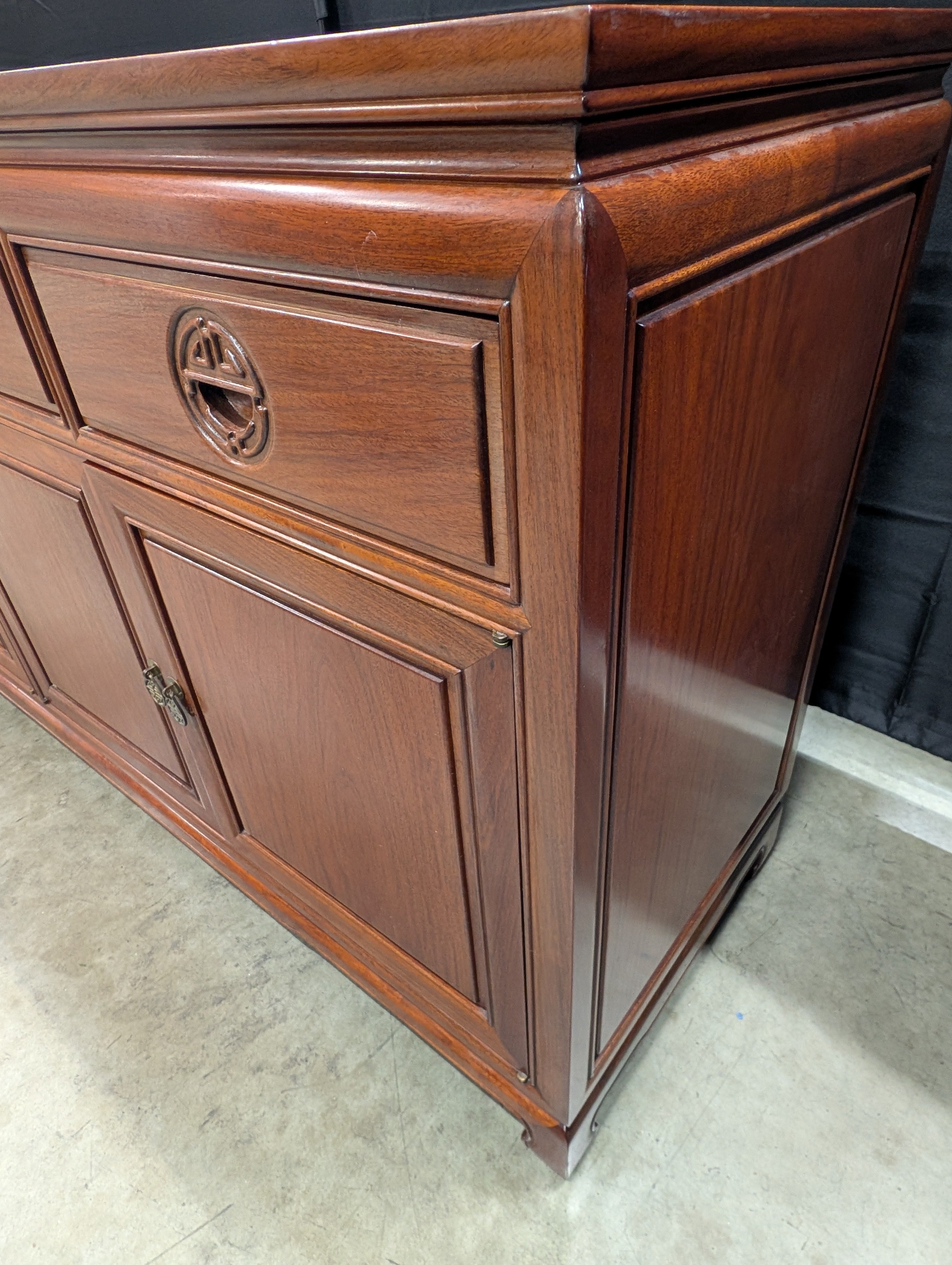 Rich Toned Wooden Sideboard with Carved Accents