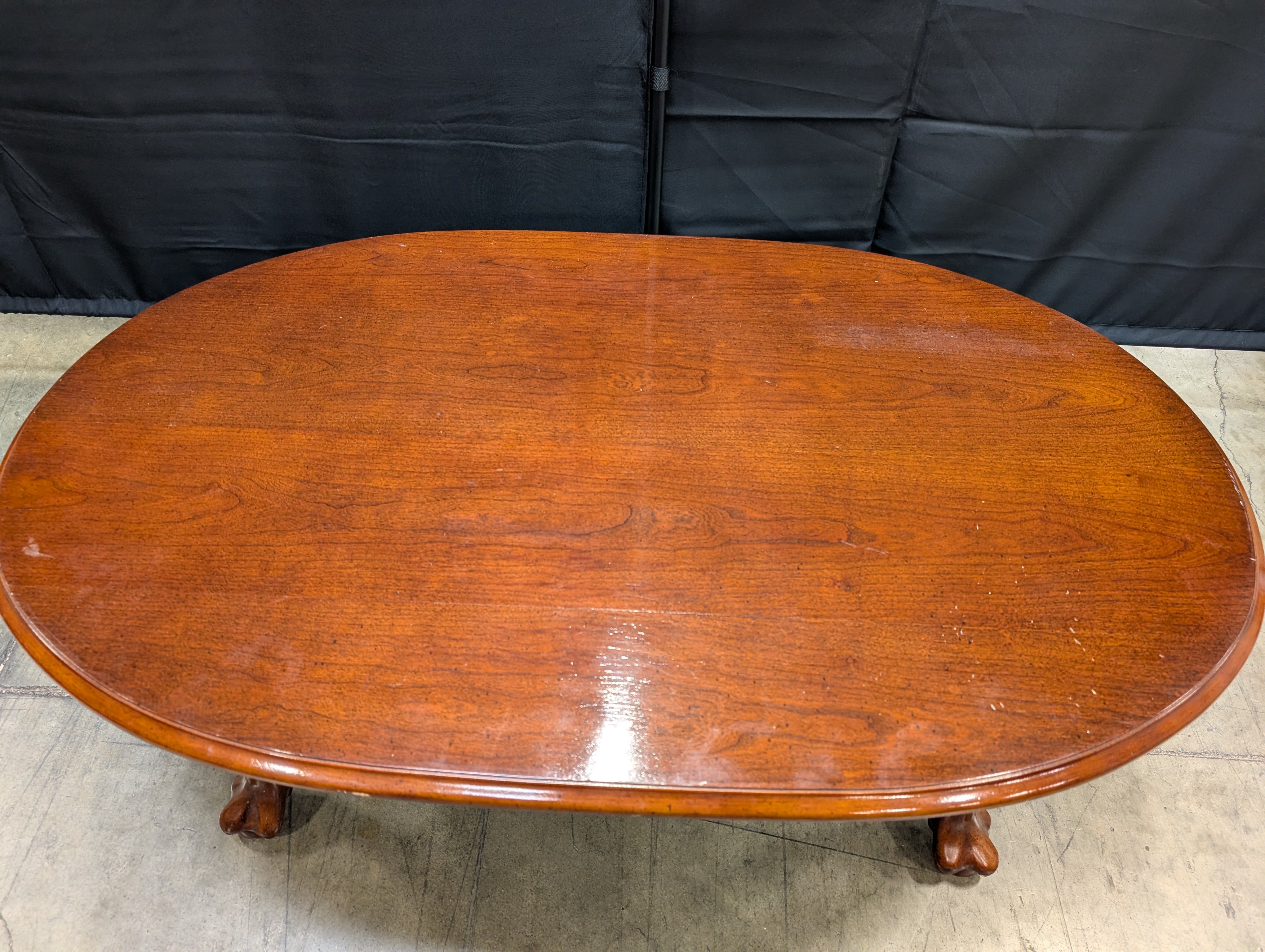 Rich Cherry Wood Oval Coffee Table with Curved Legs