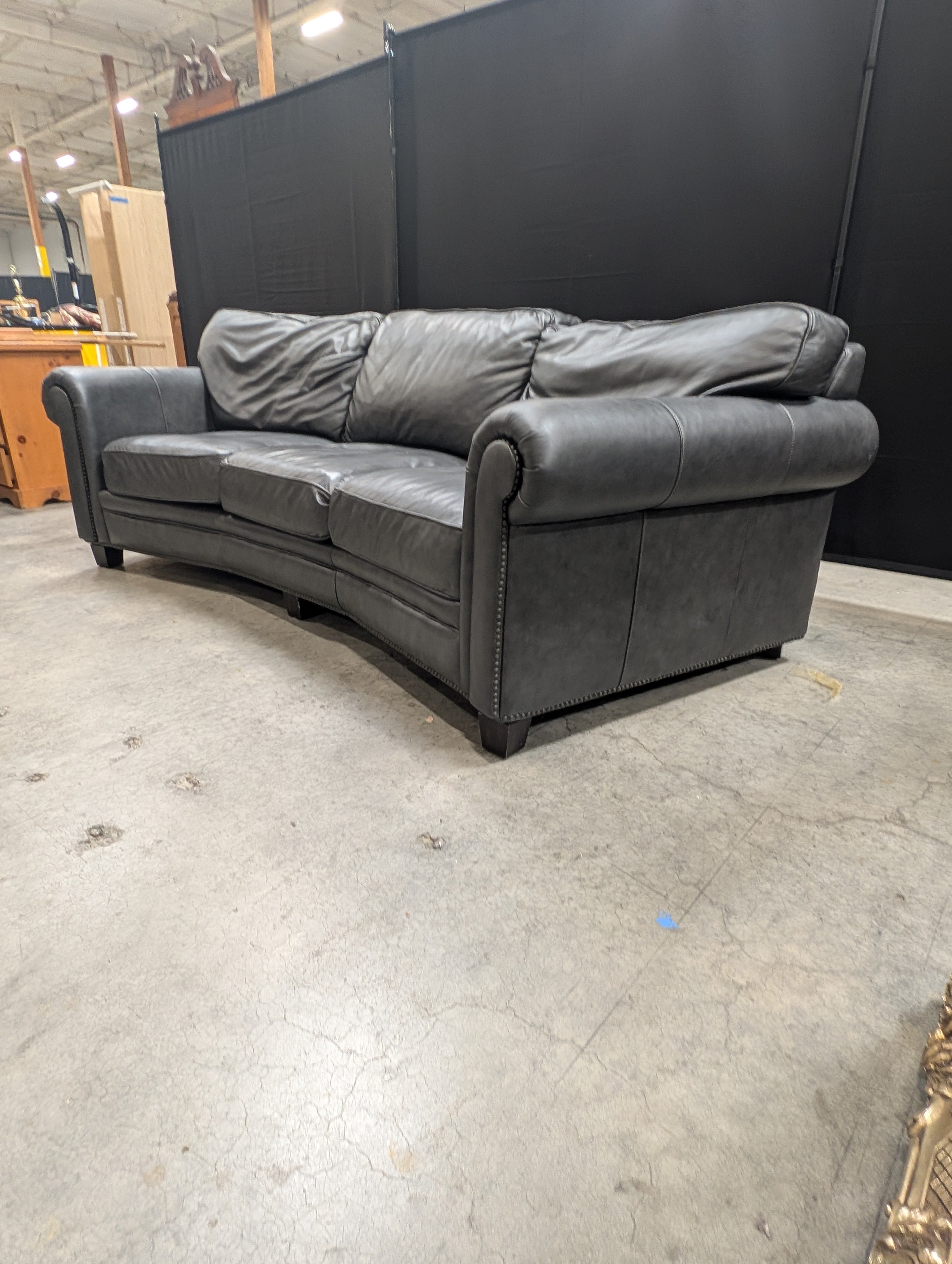 Curved Dark Grey Leather Three-Seater Sofa