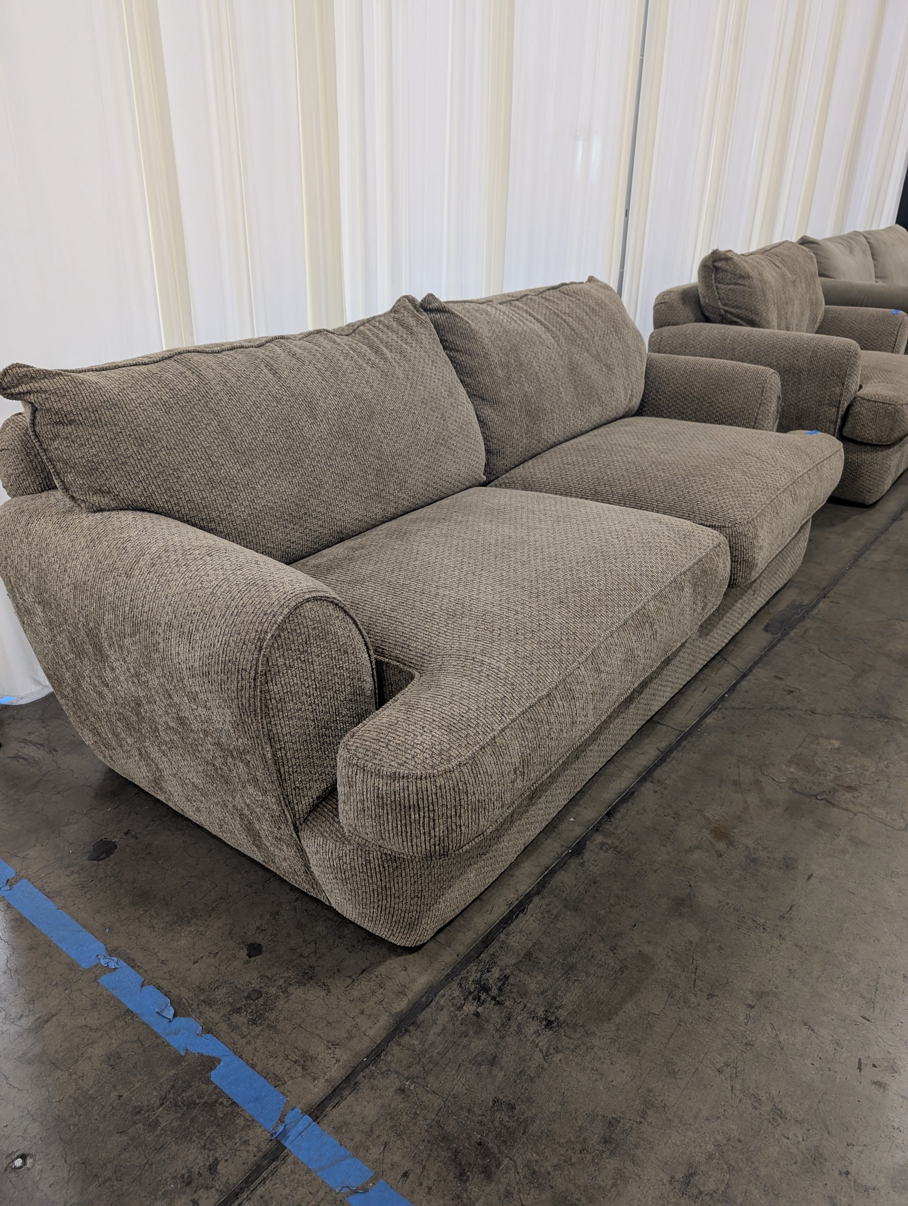 Textured Tan Fabric Two-Cushion Couch with Rolled Arms