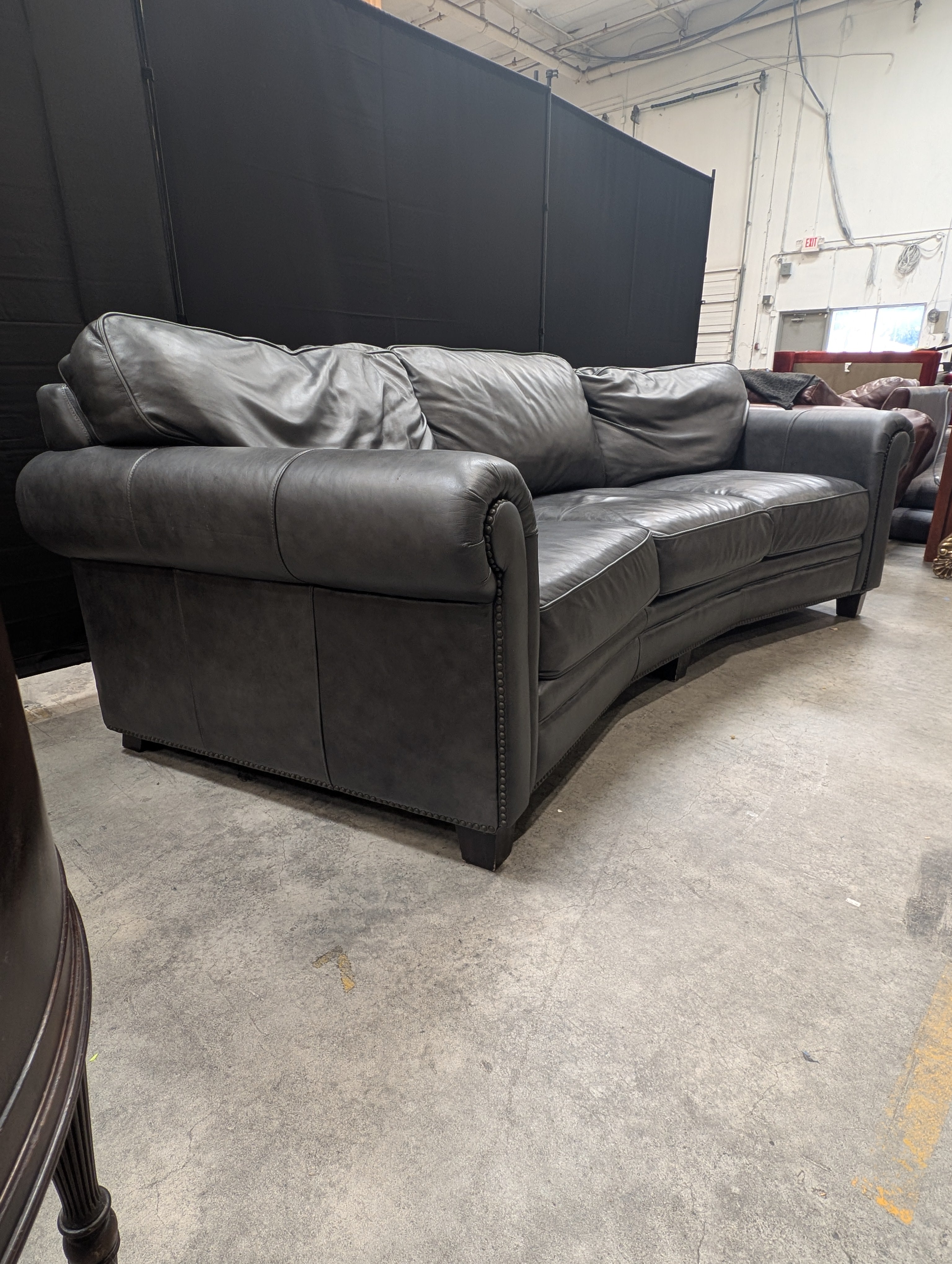 Curved Dark Grey Leather Three-Seater Sofa