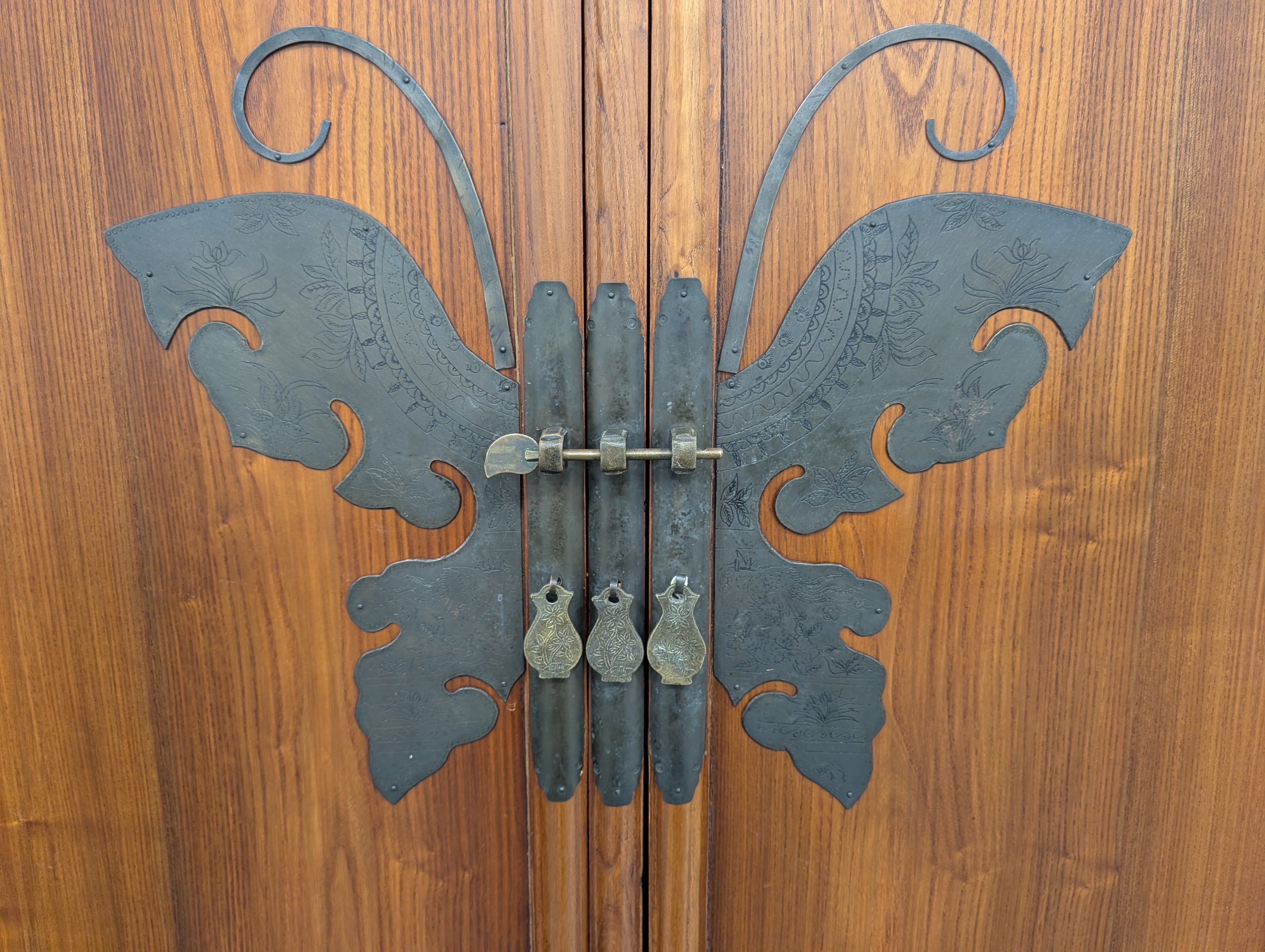 Ornate Hardwood Storage Cabinet with Decorative Butterfly Latch