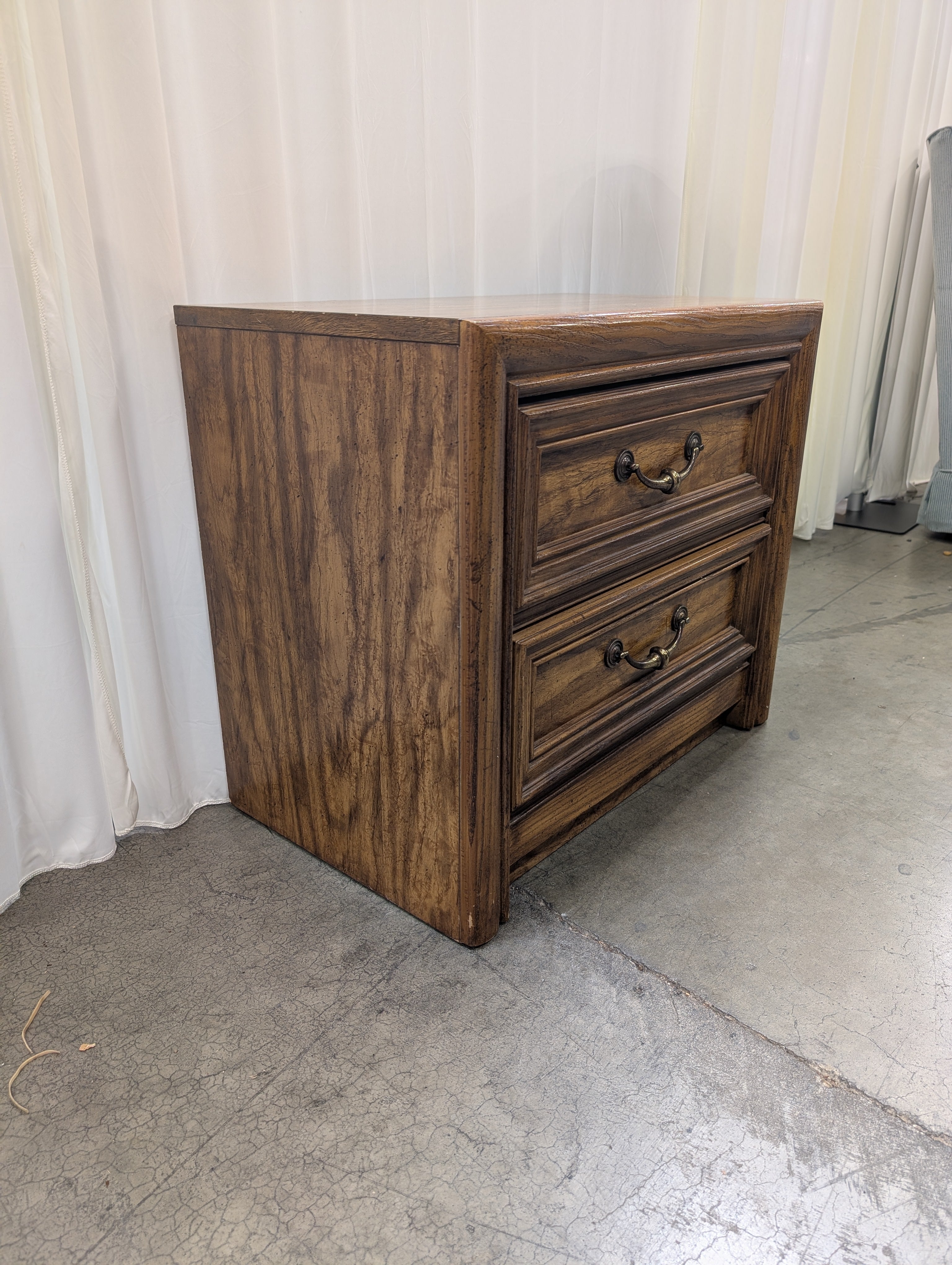 Warm Brown Wood Two-Drawer Nightstand with Ornate Hardware