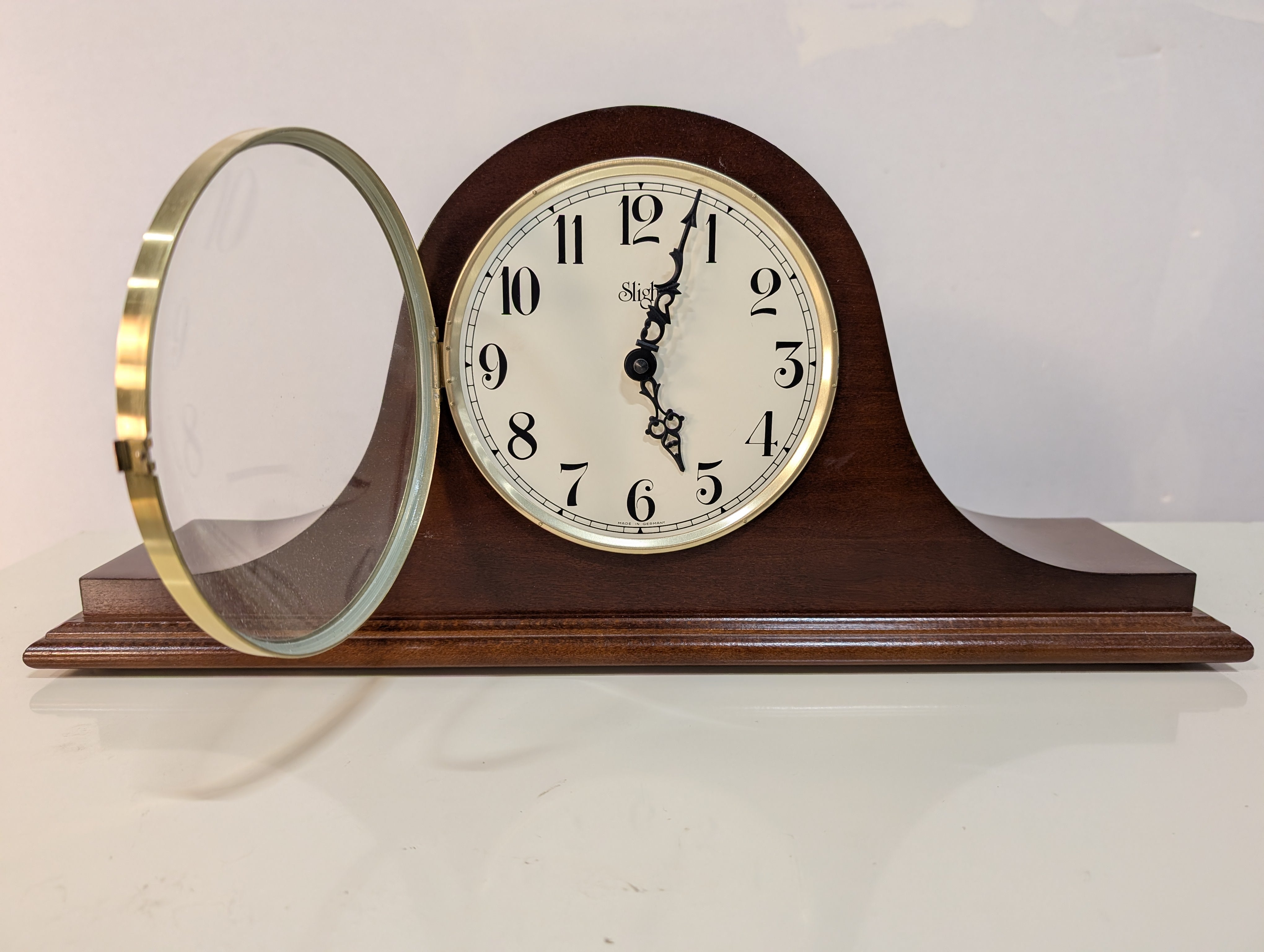 Curved Dark Wood Table Clock with Brass Tone Bezel