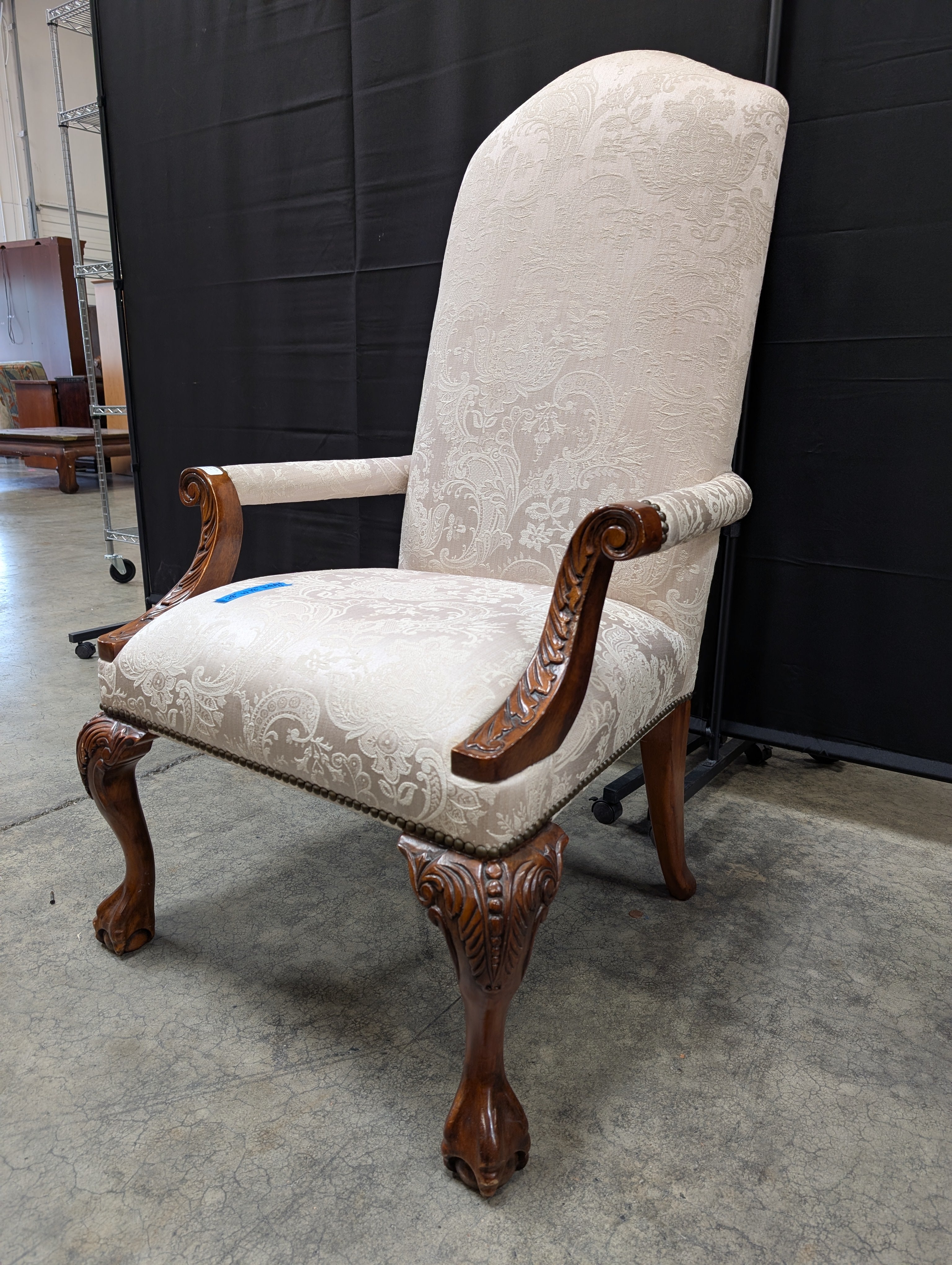 Ornate Carved Wood High-Back Armchair with Damask Upholstery
