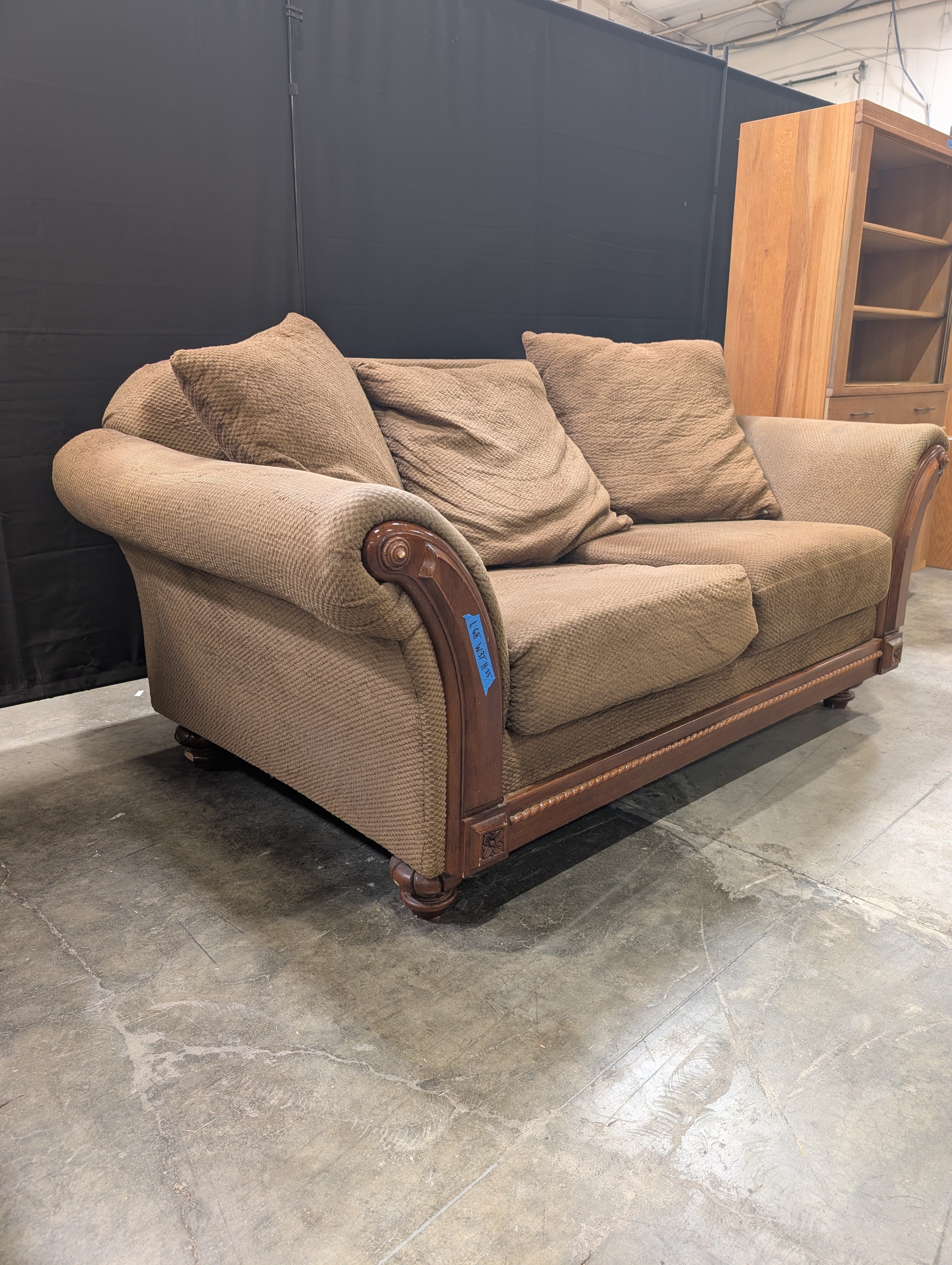 Brown Textured Fabric Loveseat with Wood Trim