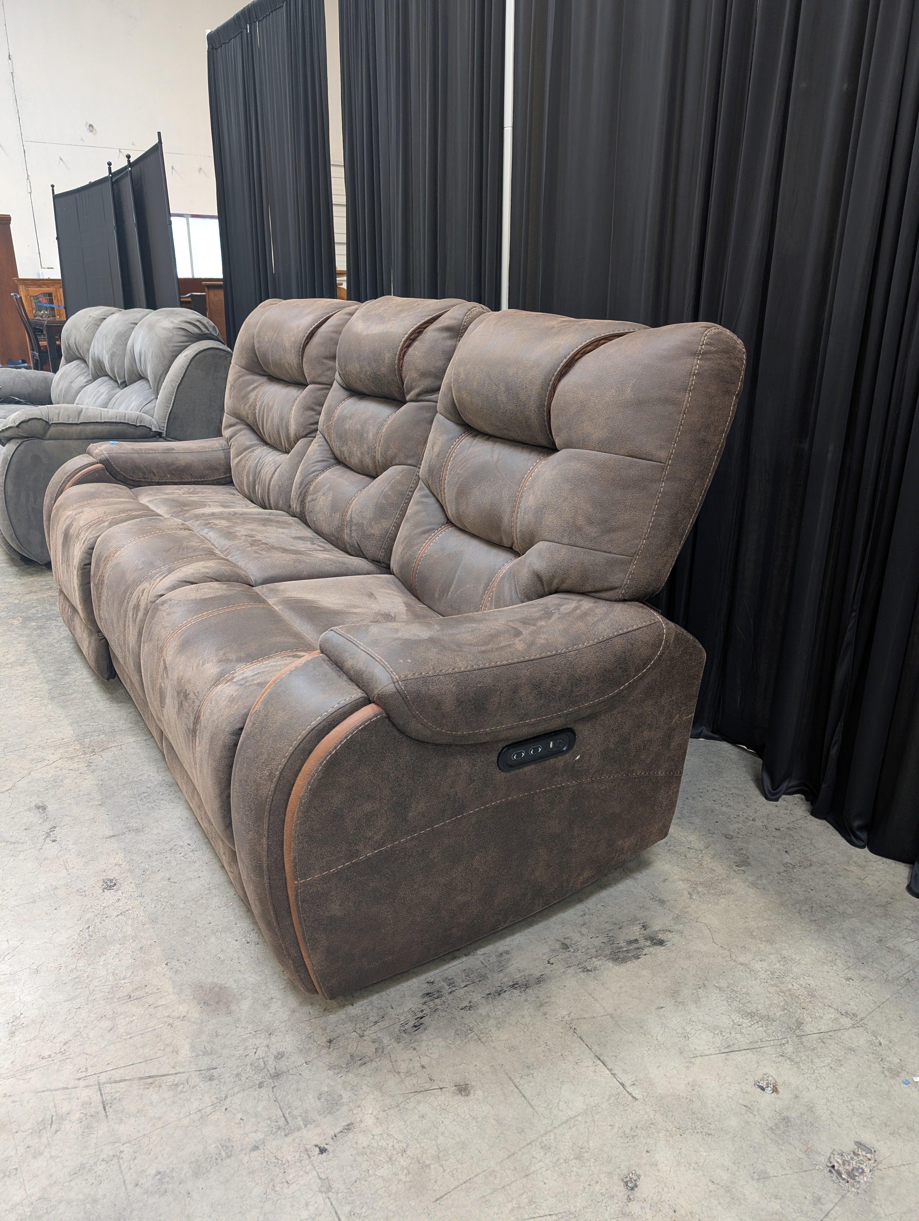 Distressed Brown Three-Seat Reclining Couch