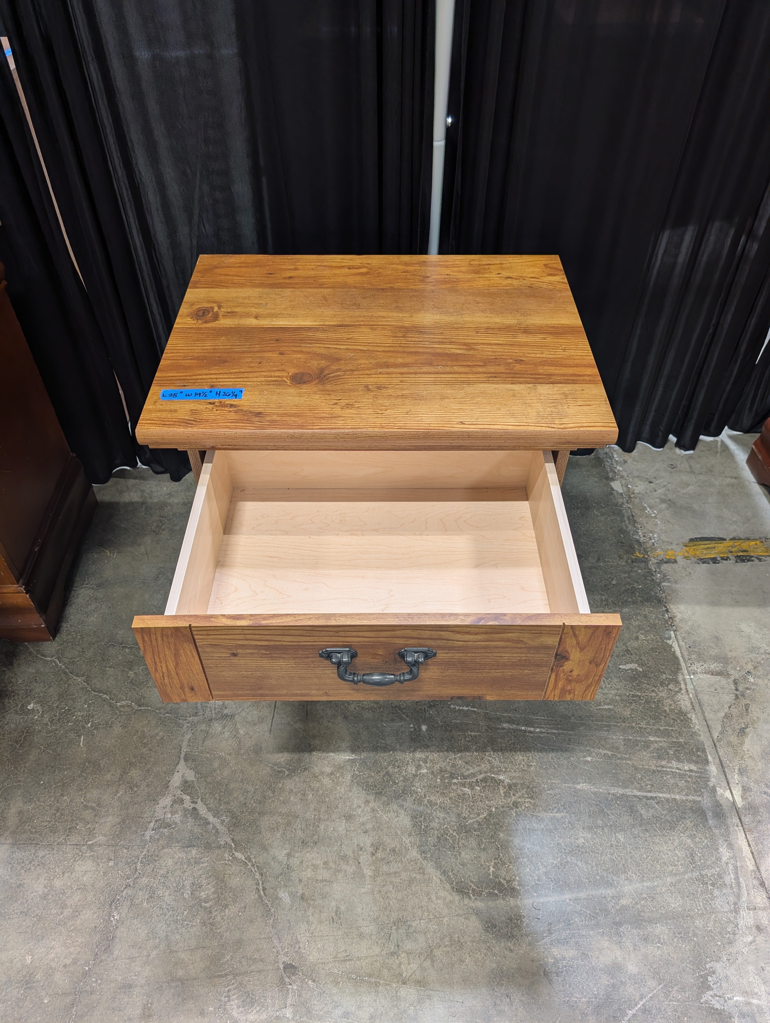 Brown Stained Wood Nightstand with Ornate Drawer Pull