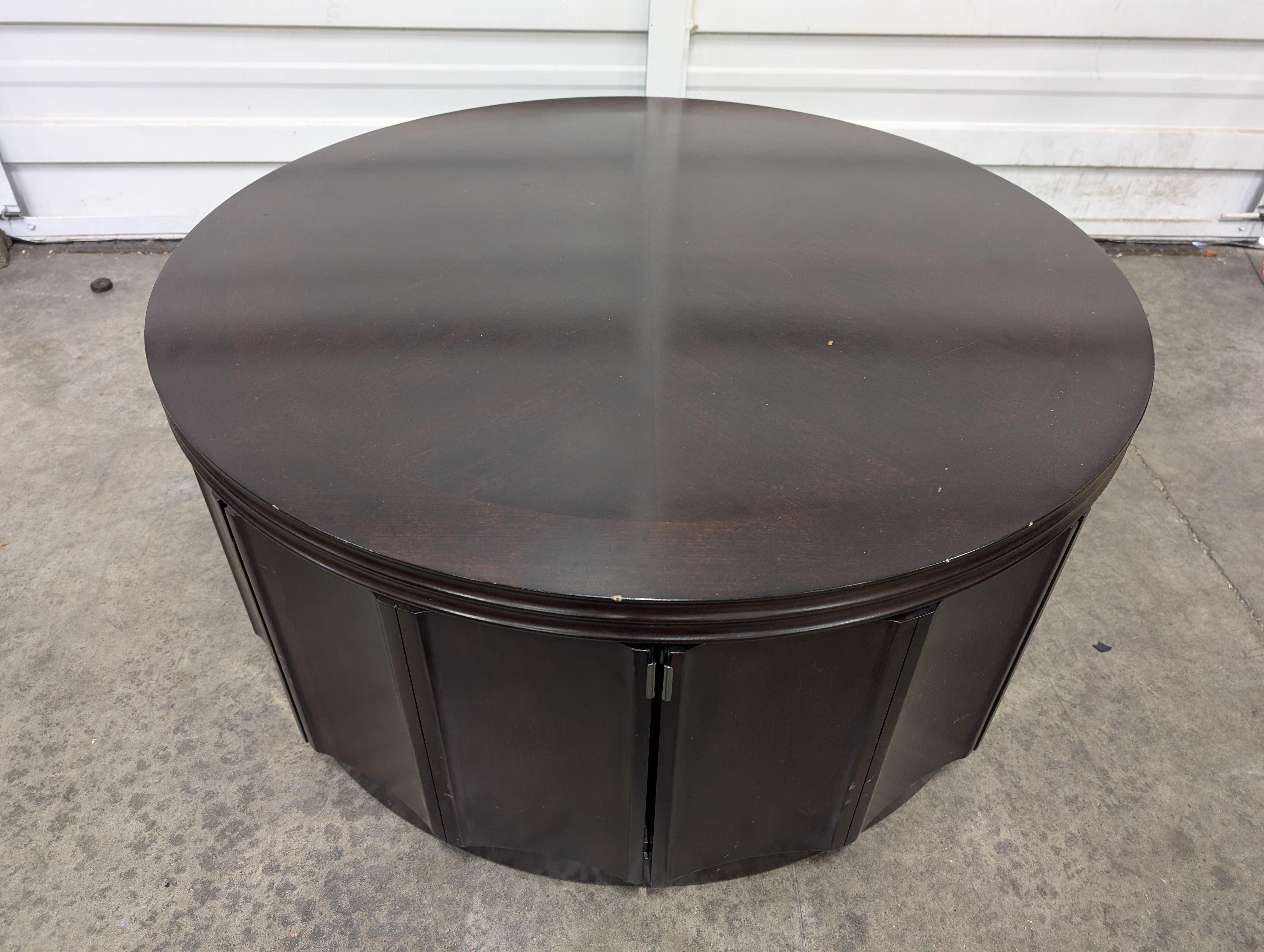 Circular Dark Wood Coffee Table with Paneled Sides