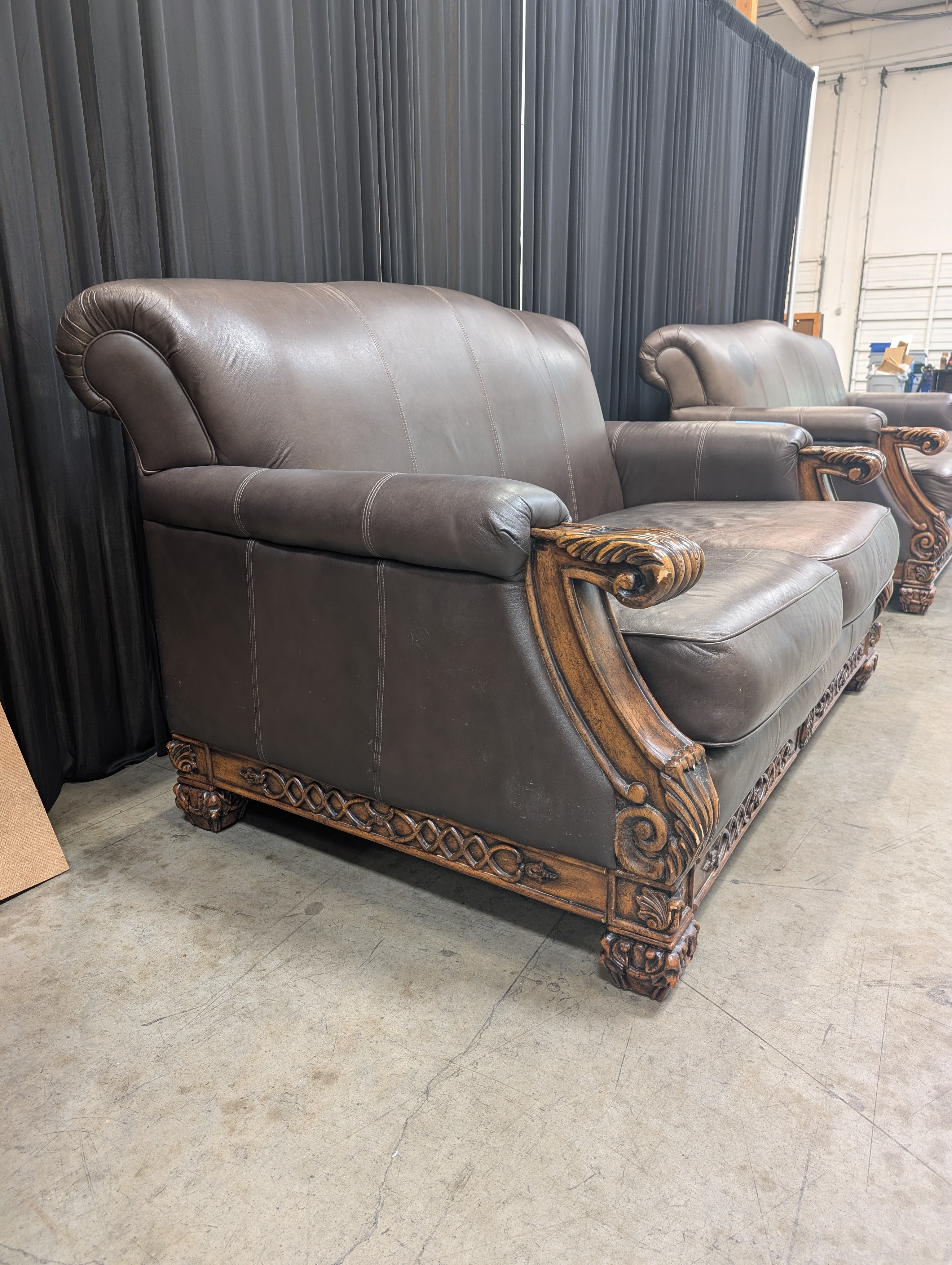 Traditional Brown Leather Loveseat with Carved Wood