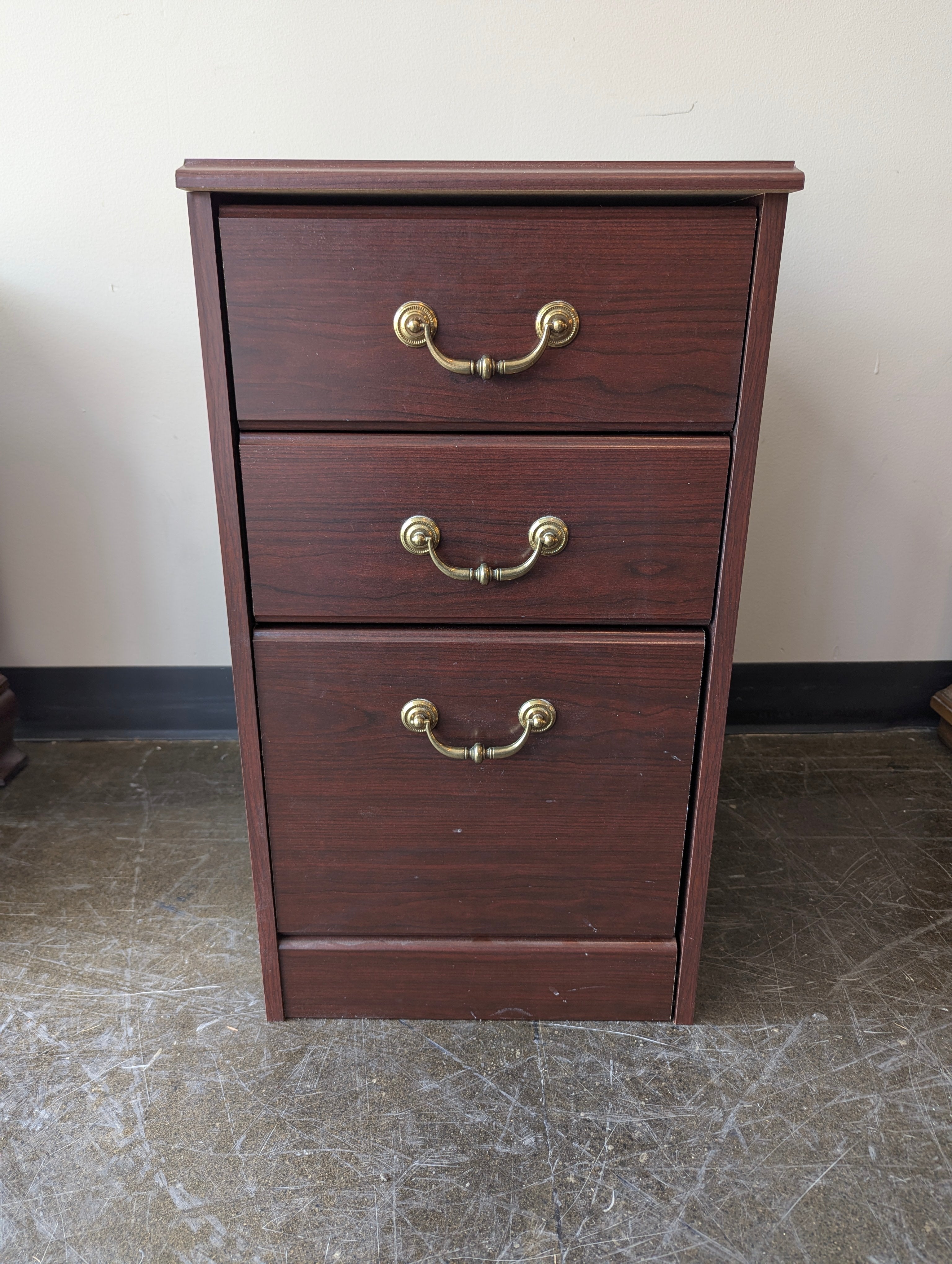 Compact Dark Wood Three-Drawer Storage Cabinet