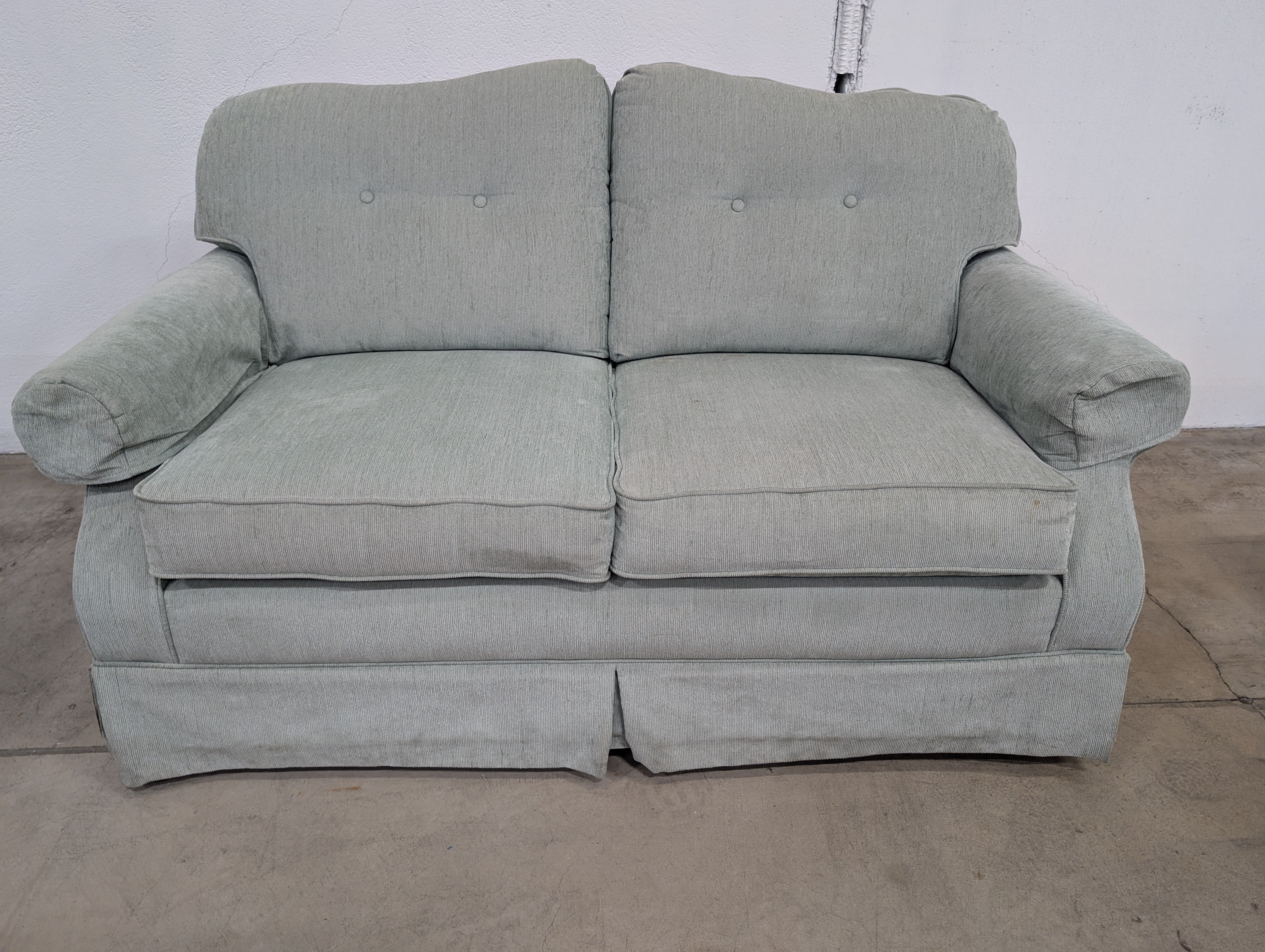 Muted Light Blue-Green Upholstered Two-Seater Sofa with Skirted Base