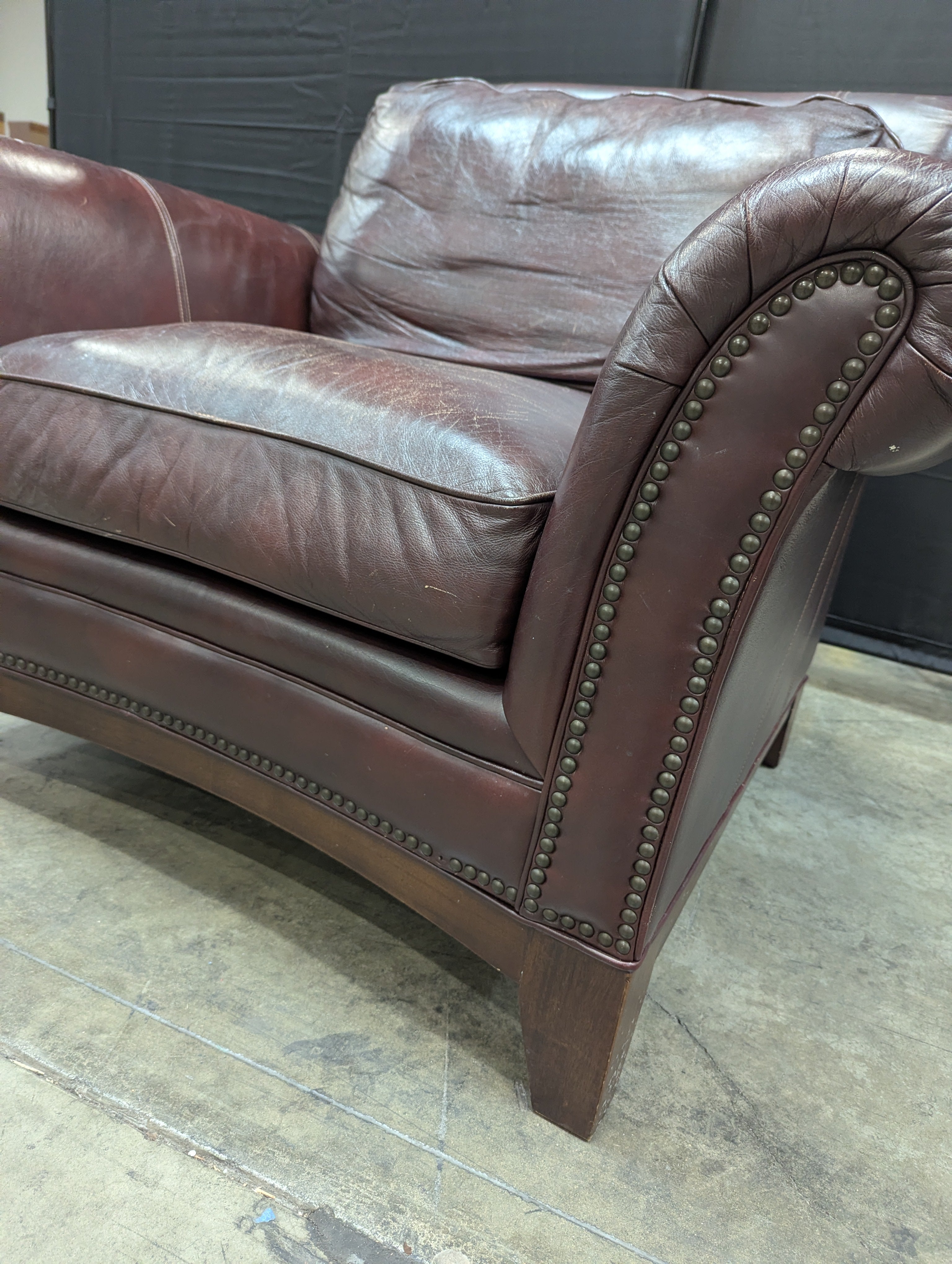 Traditional Deep Reddish-Brown Leather Armchair with Nailhead Trim