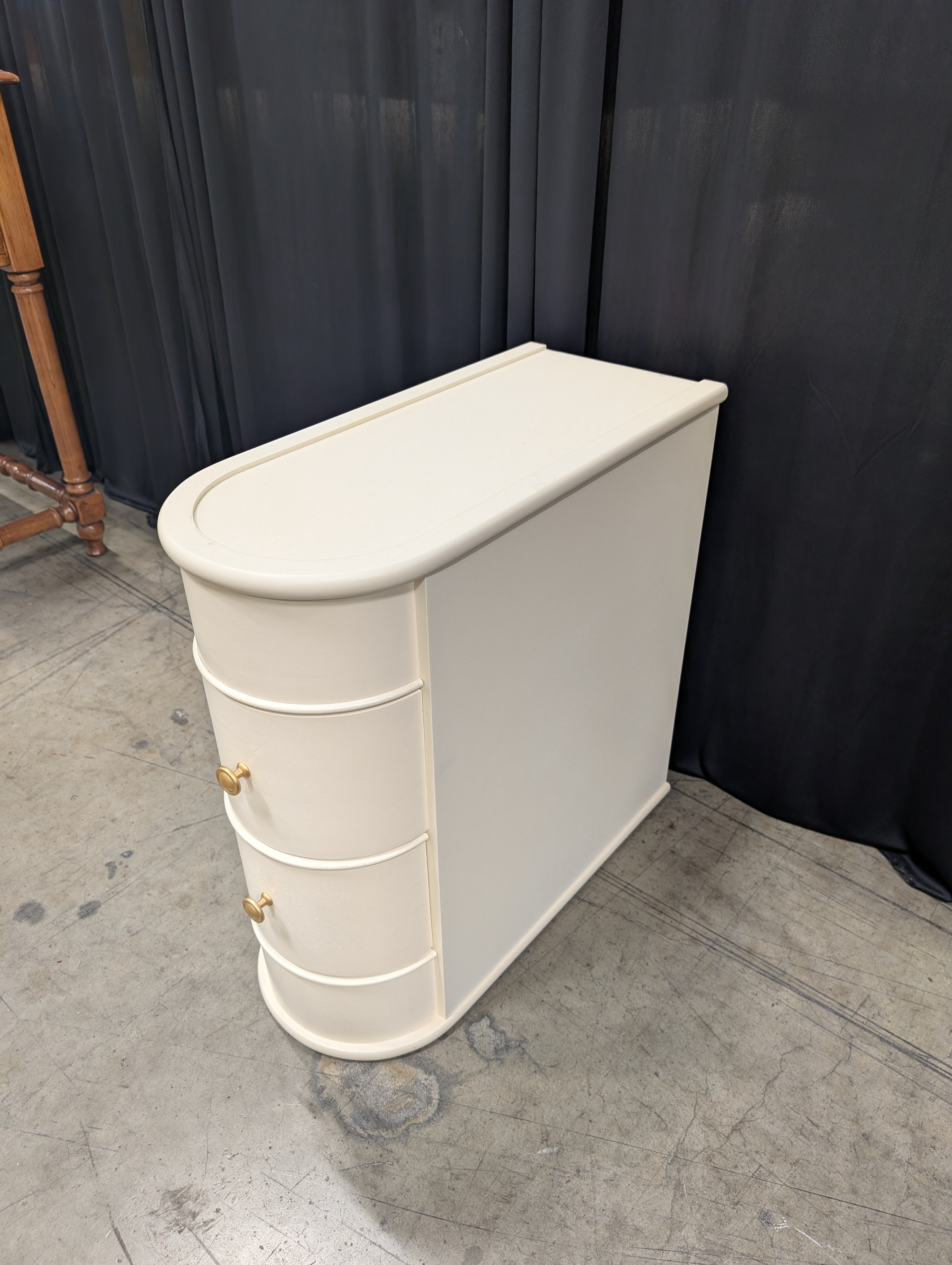 Cream Curved Two-Drawer Nightstand with Gold Knob