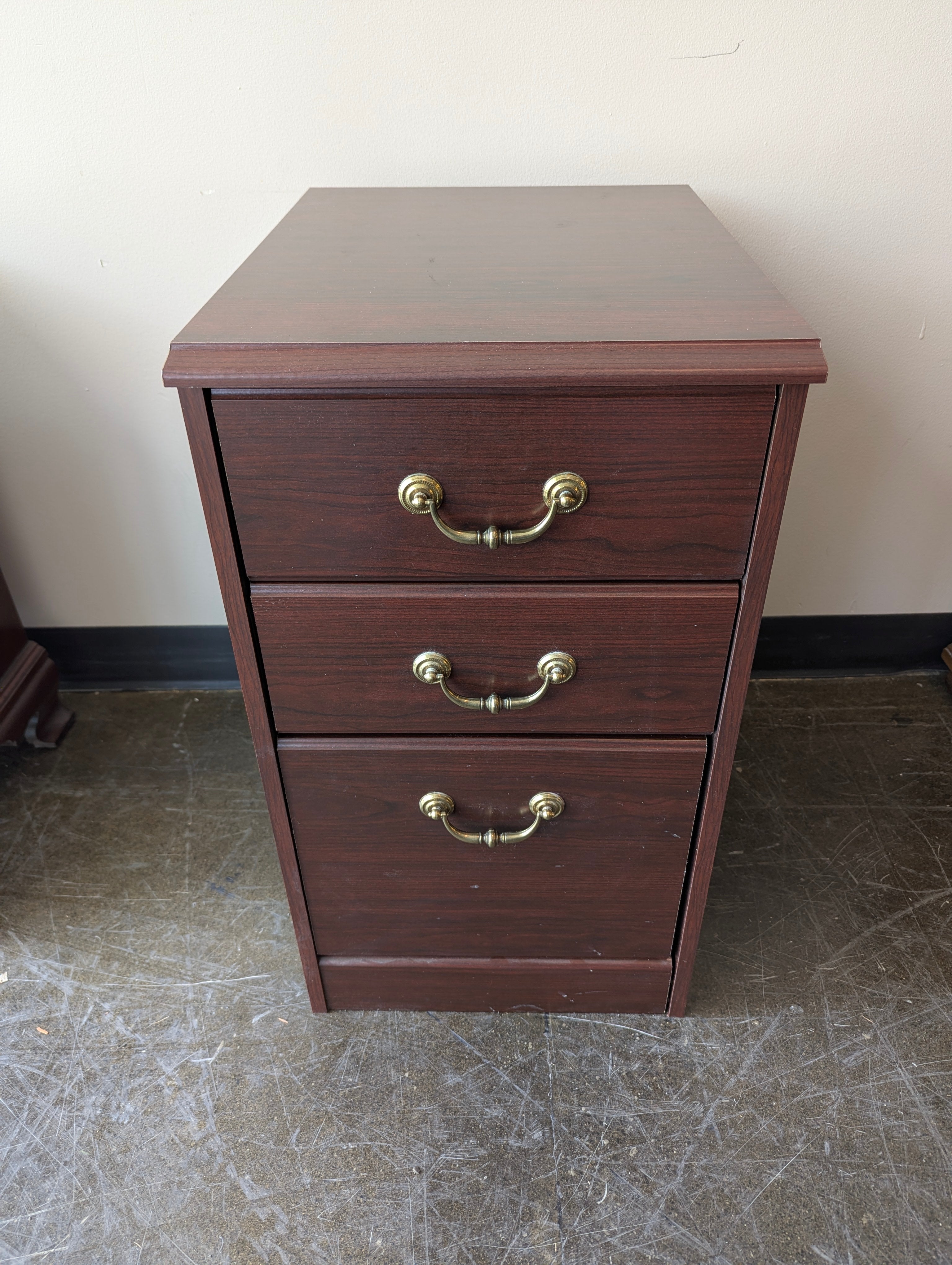 Compact Dark Wood Three-Drawer Storage Cabinet