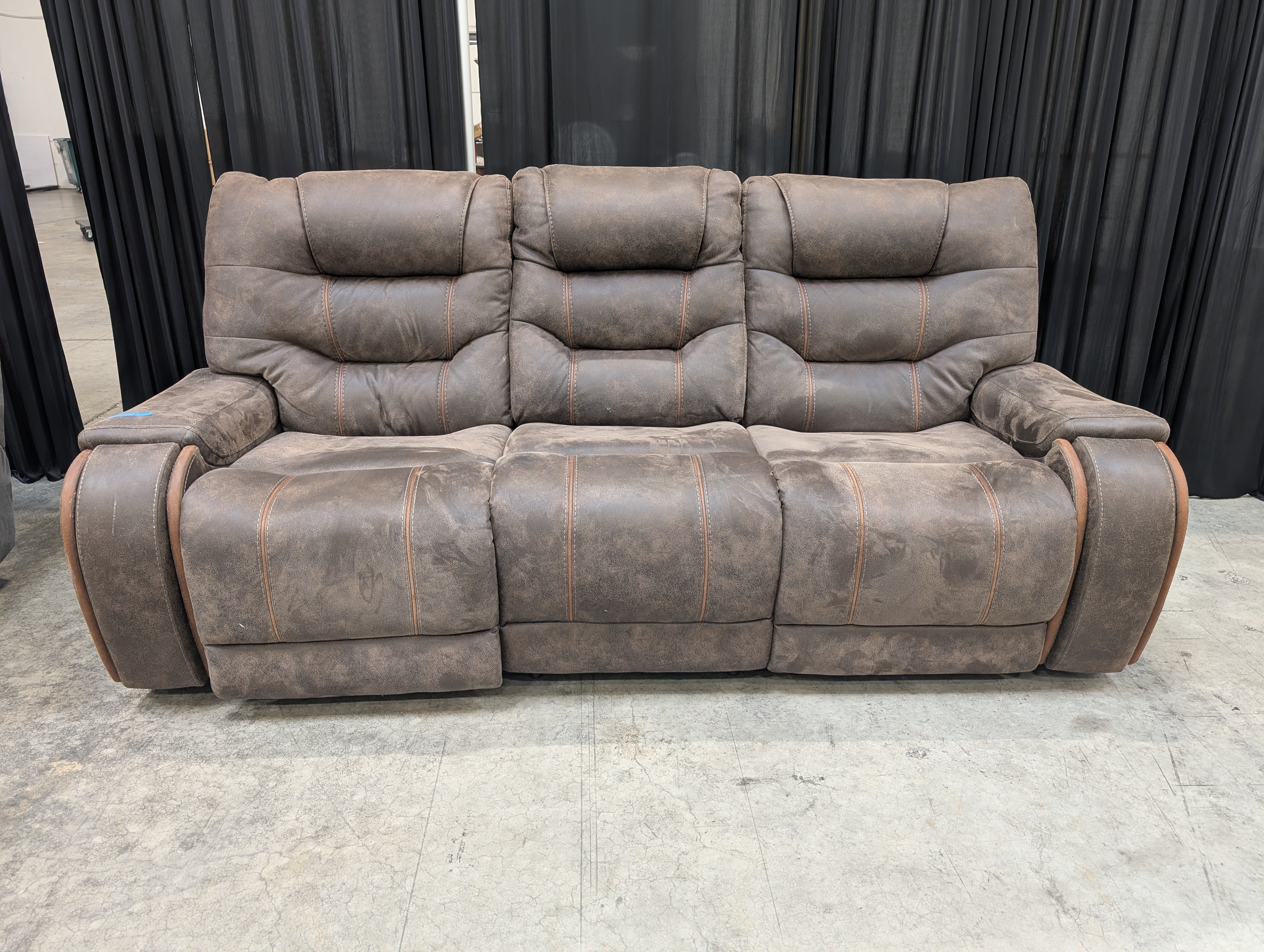 Distressed Brown Three-Seat Reclining Couch