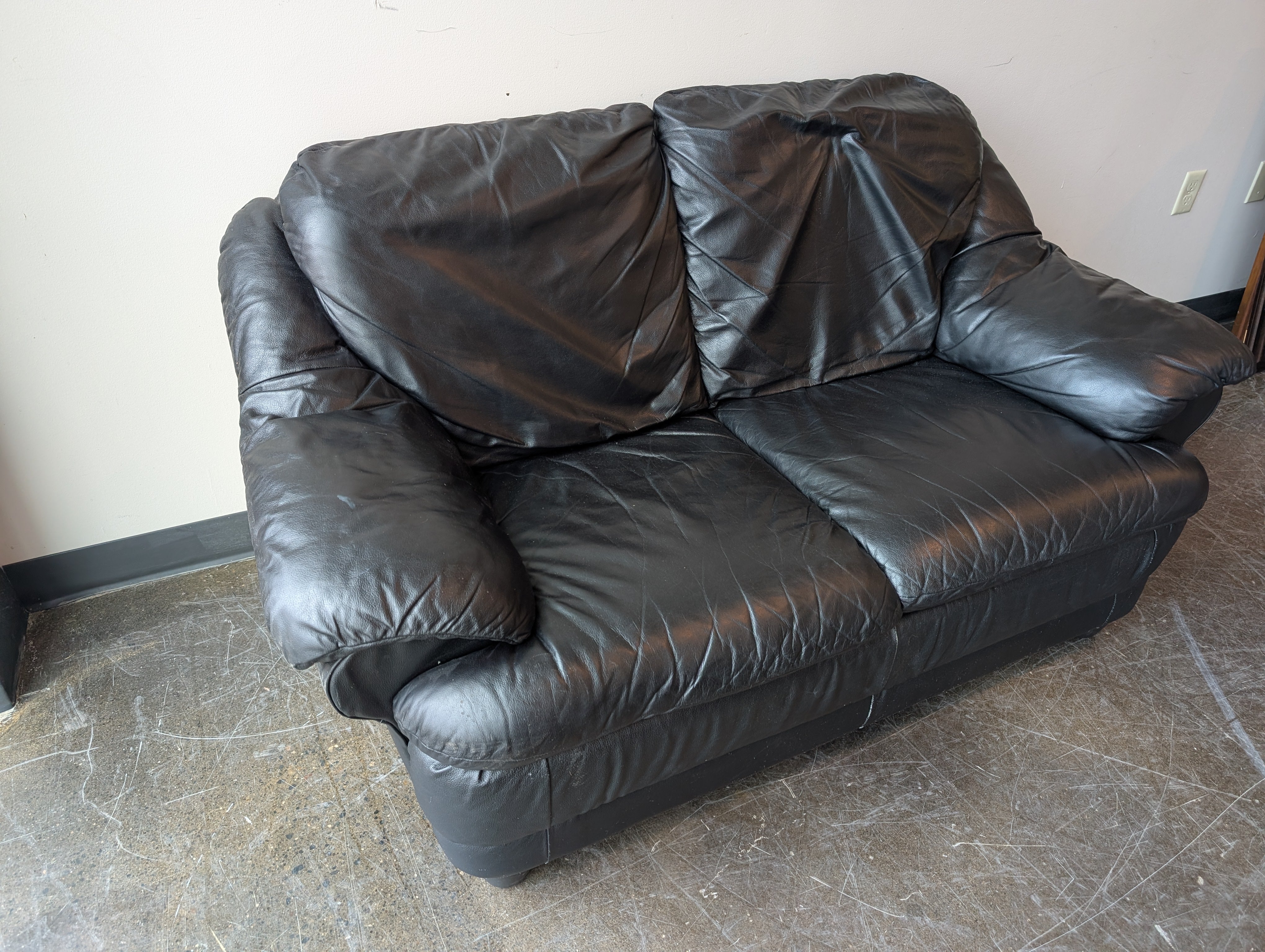 Spacious Black Leather Loveseat
