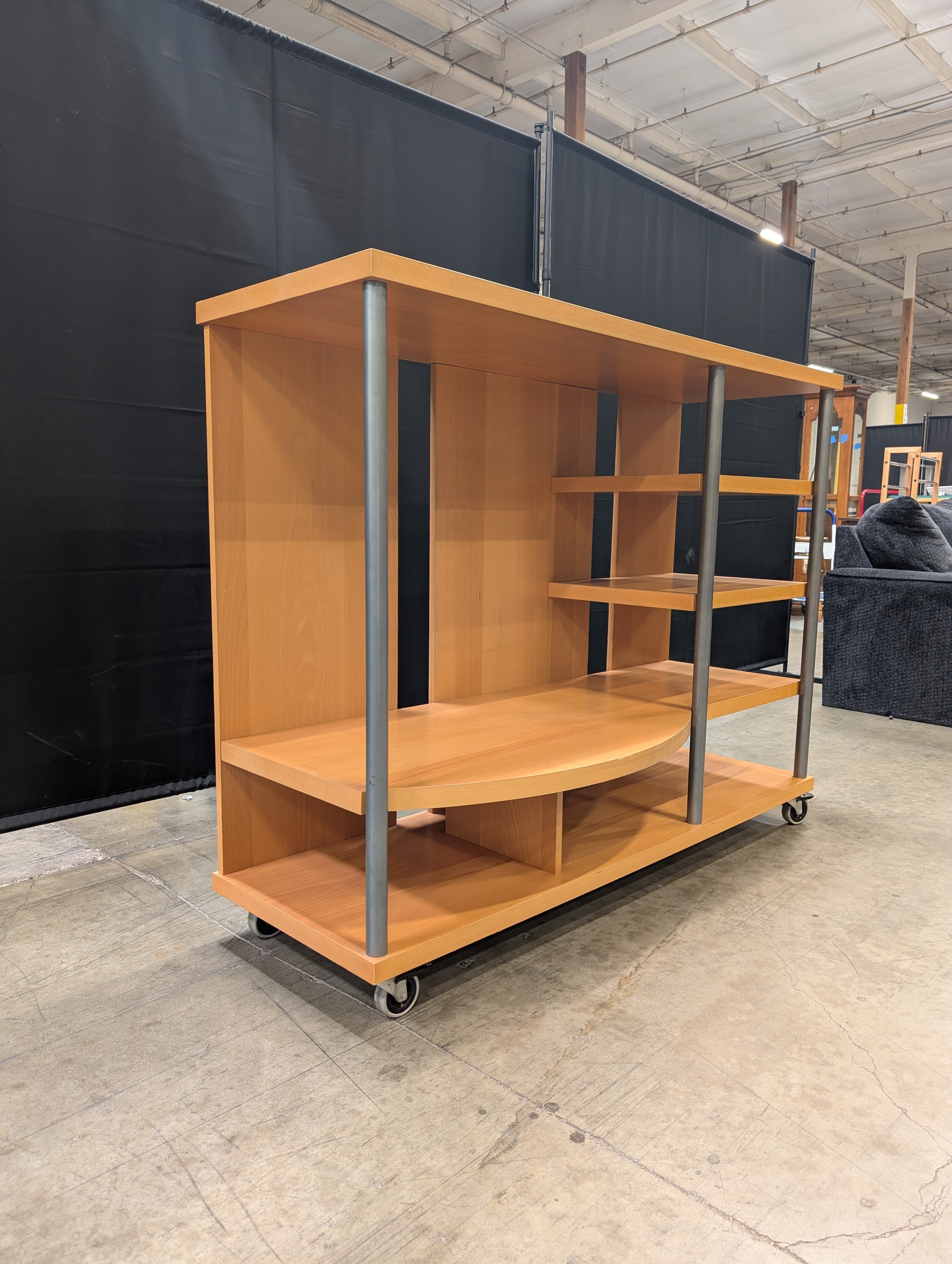 Contemporary Wood Tone Shelving Unit with Metal Supports and Casters