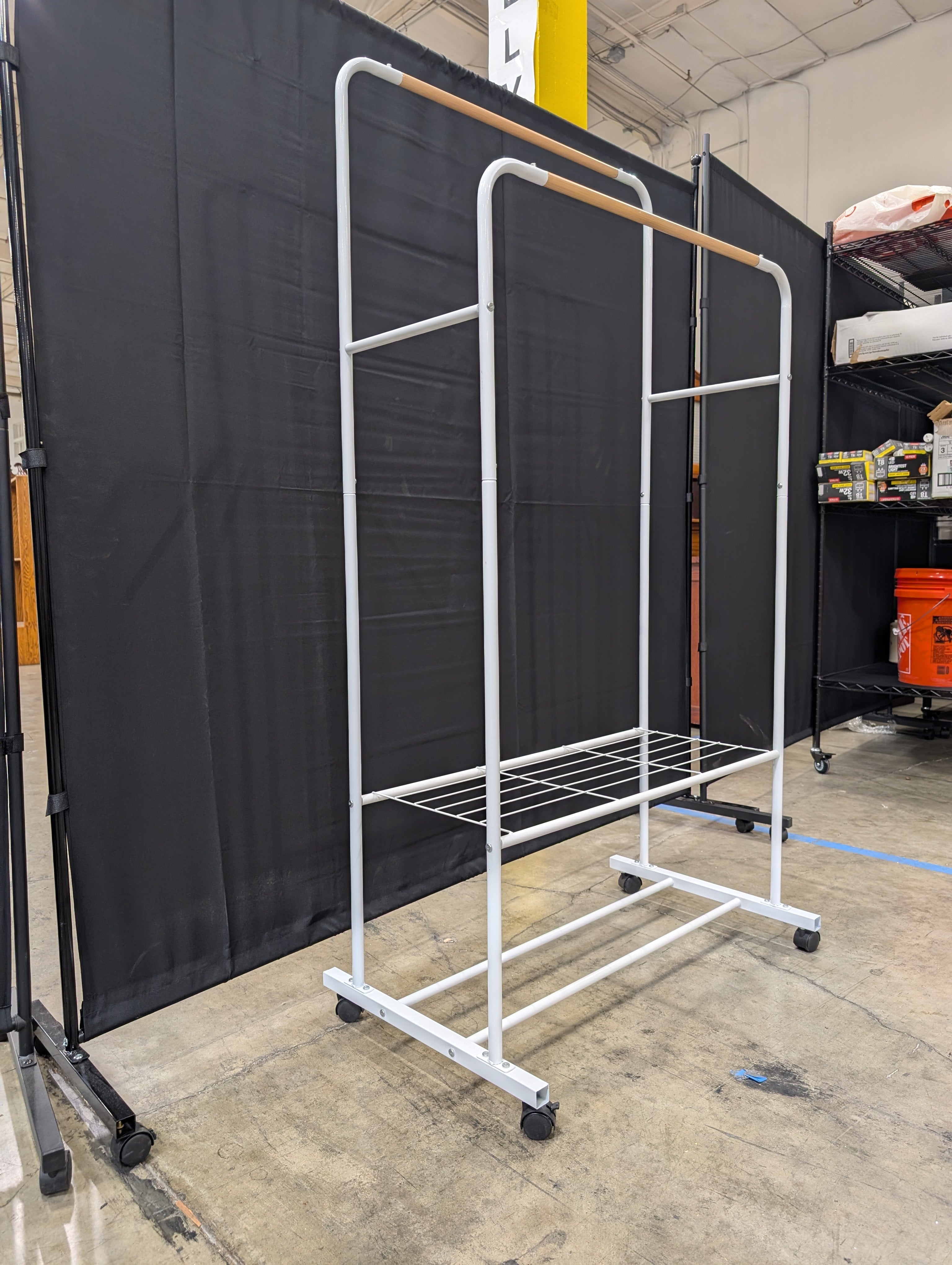 White Metal Rolling Garment Rack with Dual Hanging Rails and Storage Shelf