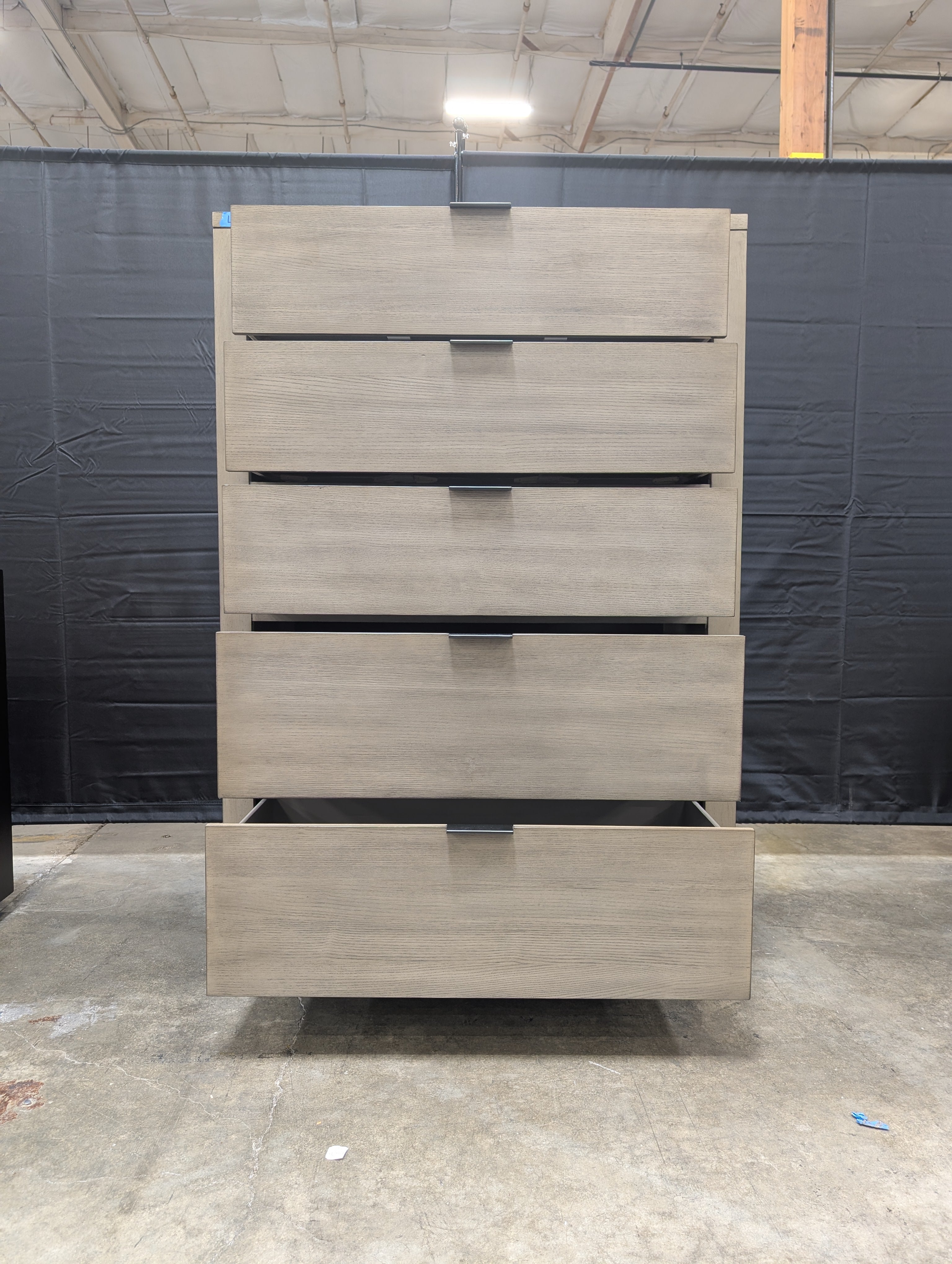 Grey Wood Five-Drawer Dresser with Metal Pulls