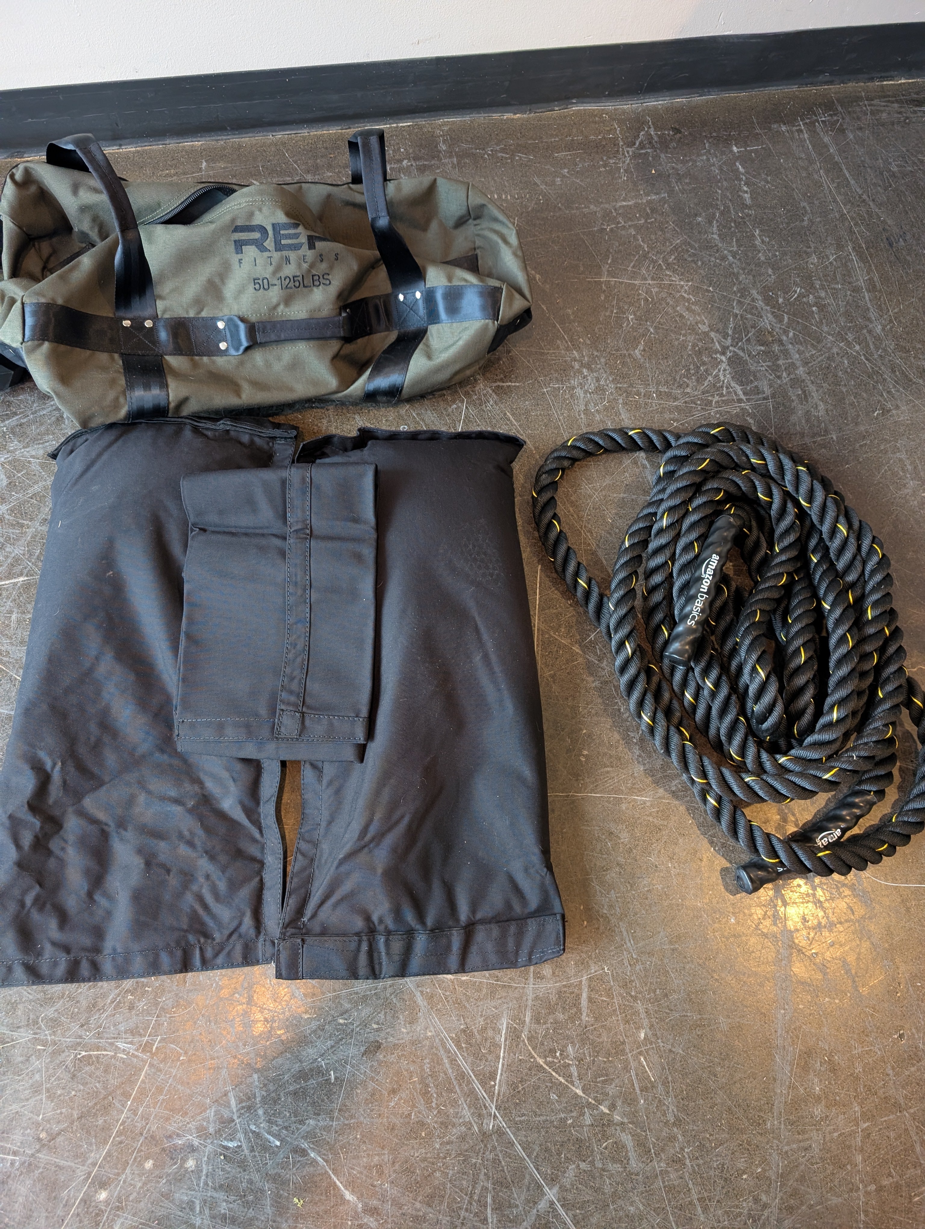 REP FITNESS Durable 50-125LBS Workout Sandbag with Battle Rope