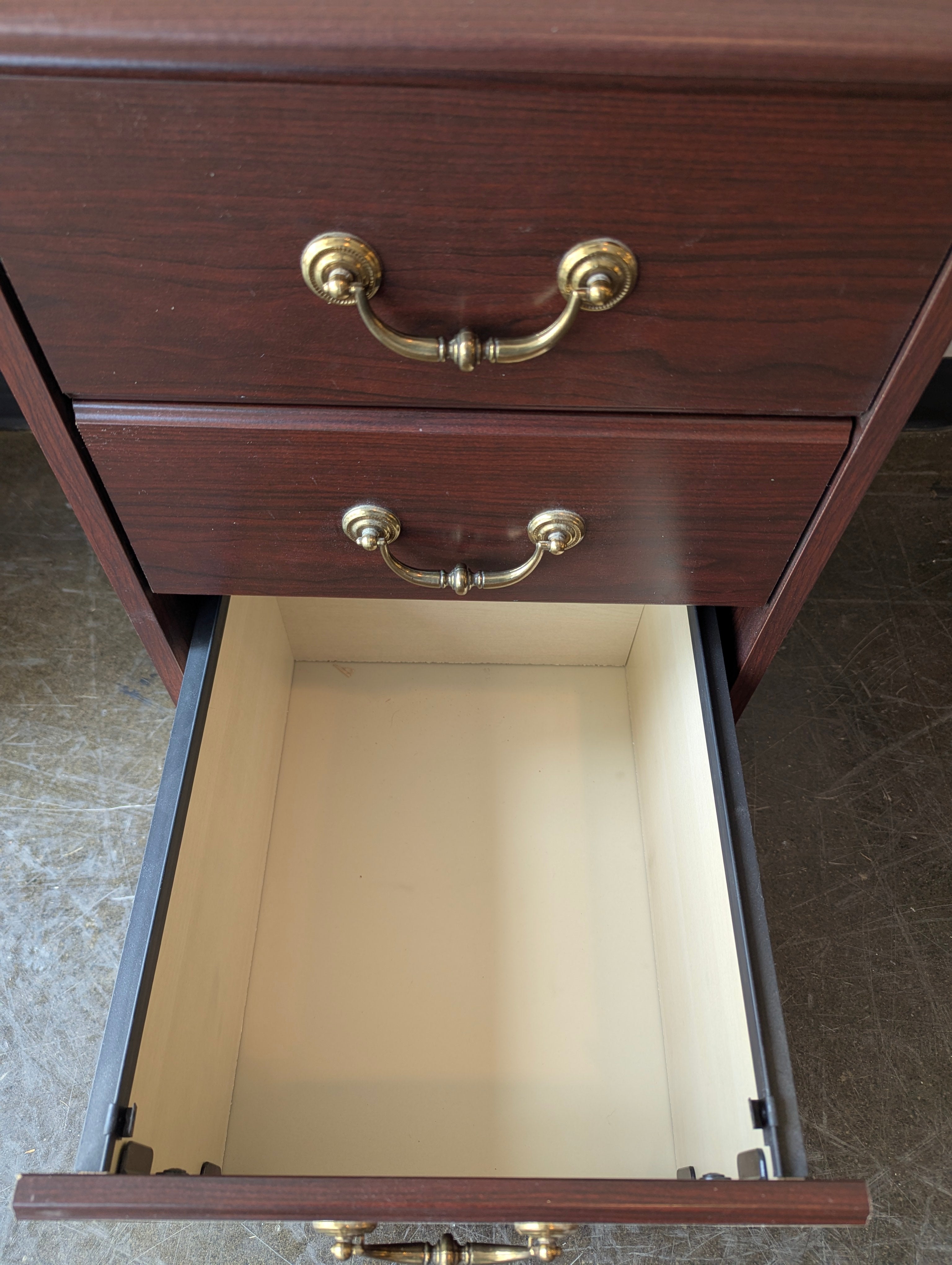 Compact Dark Wood Three-Drawer Storage Cabinet