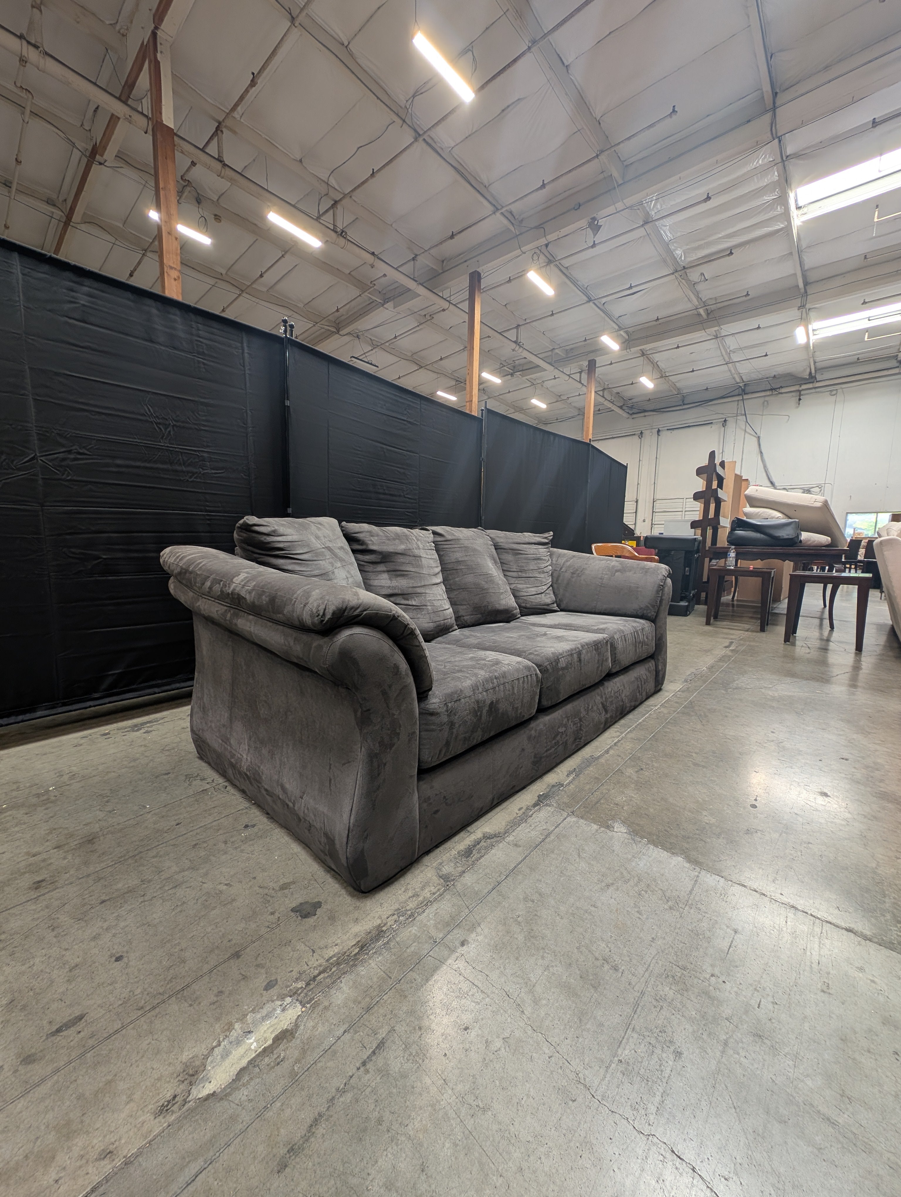 Spacious Three-Seater Grey Upholstered Sofa