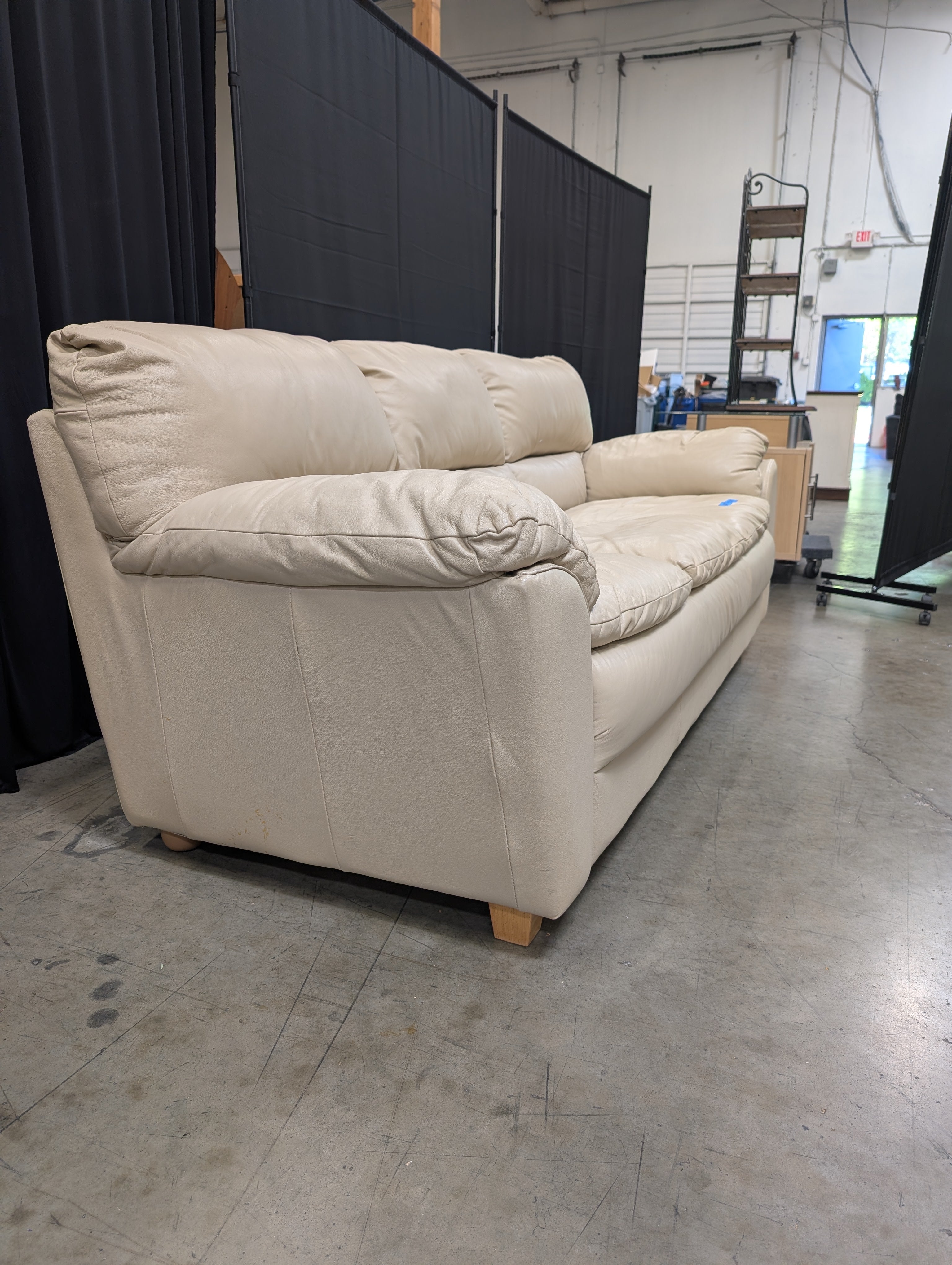 Cream Three-Seat Leather Couch with Pillow Arms