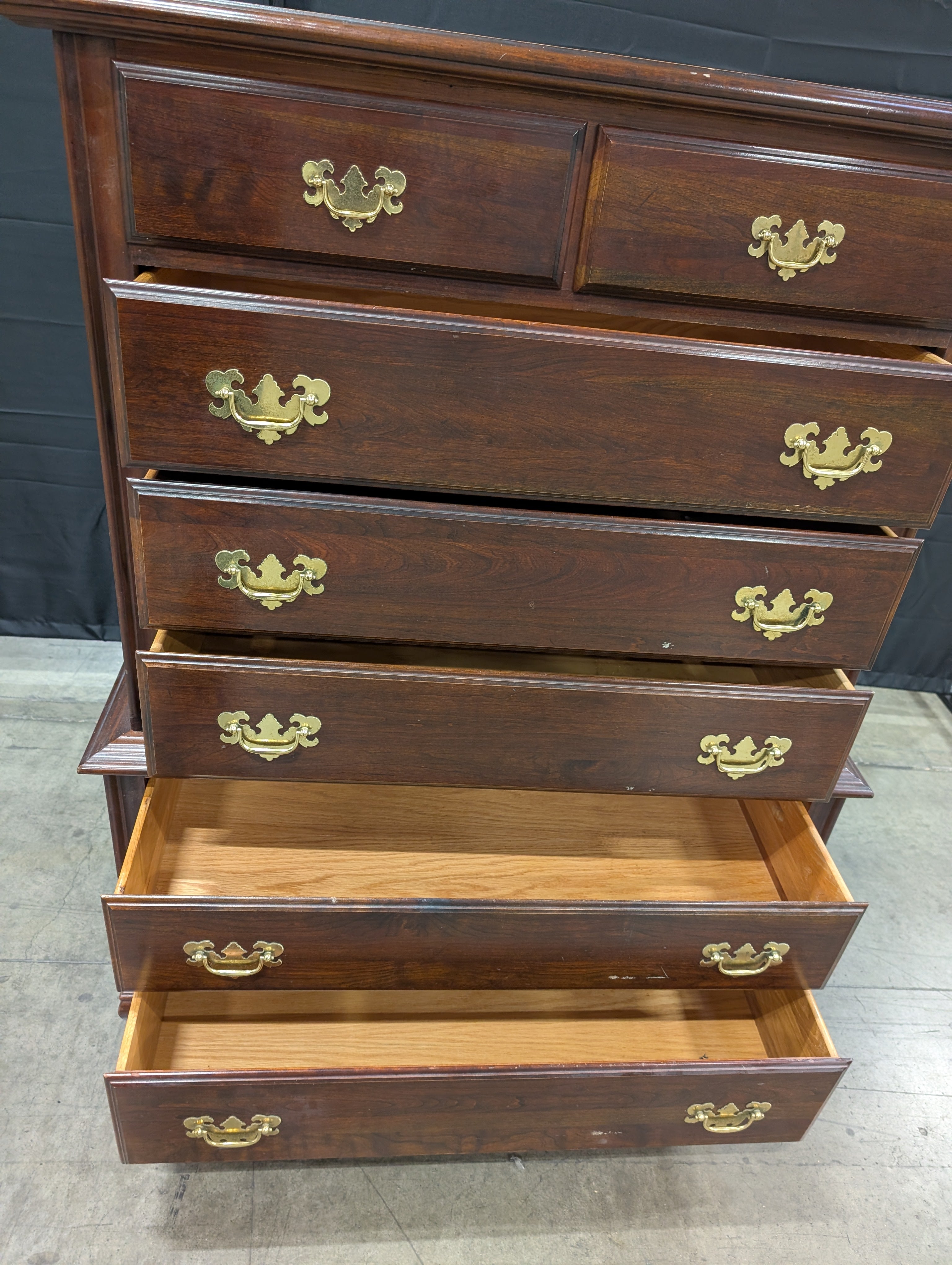 Traditional Dark Wood Chest of Drawers with Ornate Brass Pulls