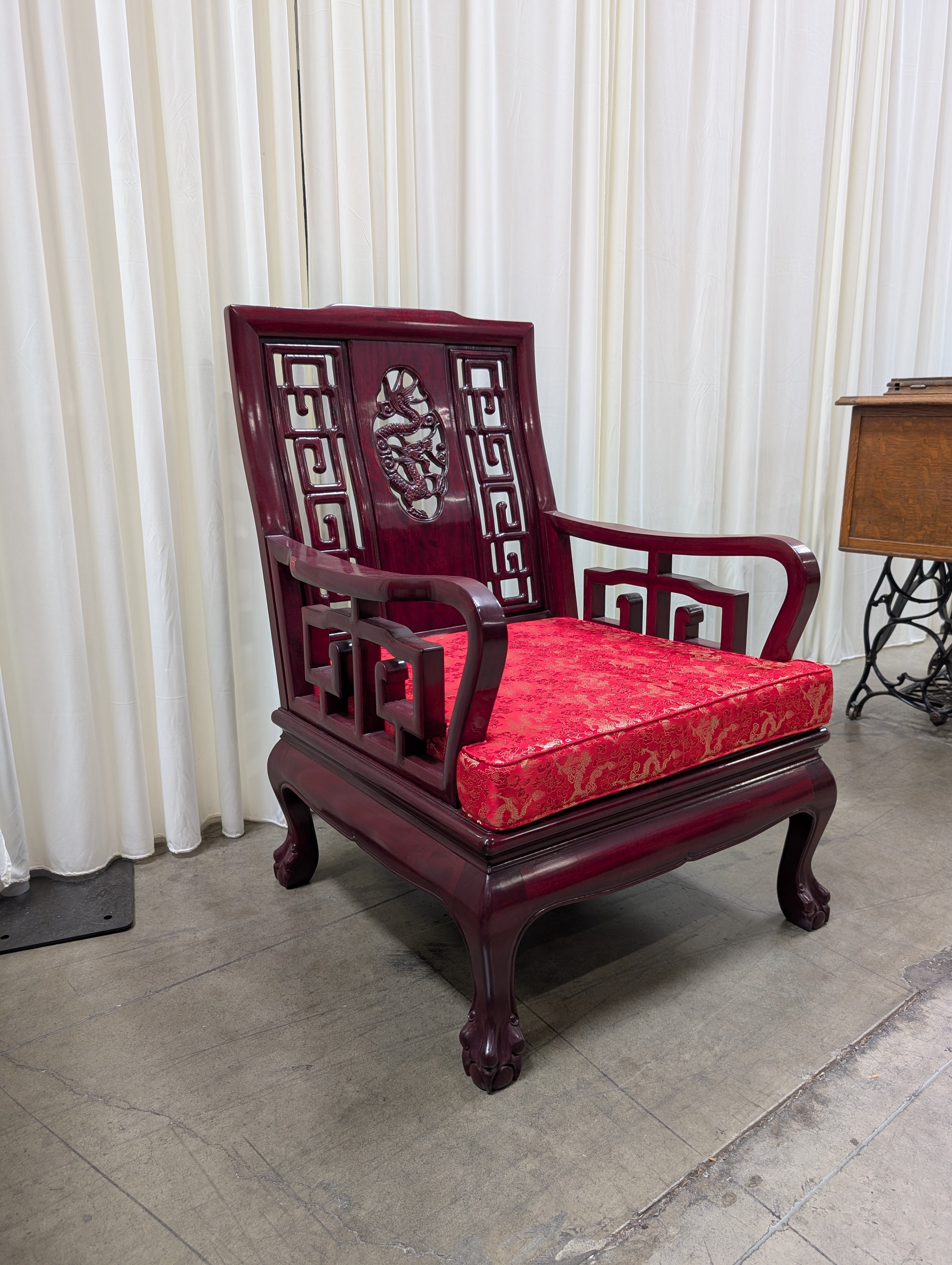 Dark Wood Carved Arm Chair with Red Cushion
