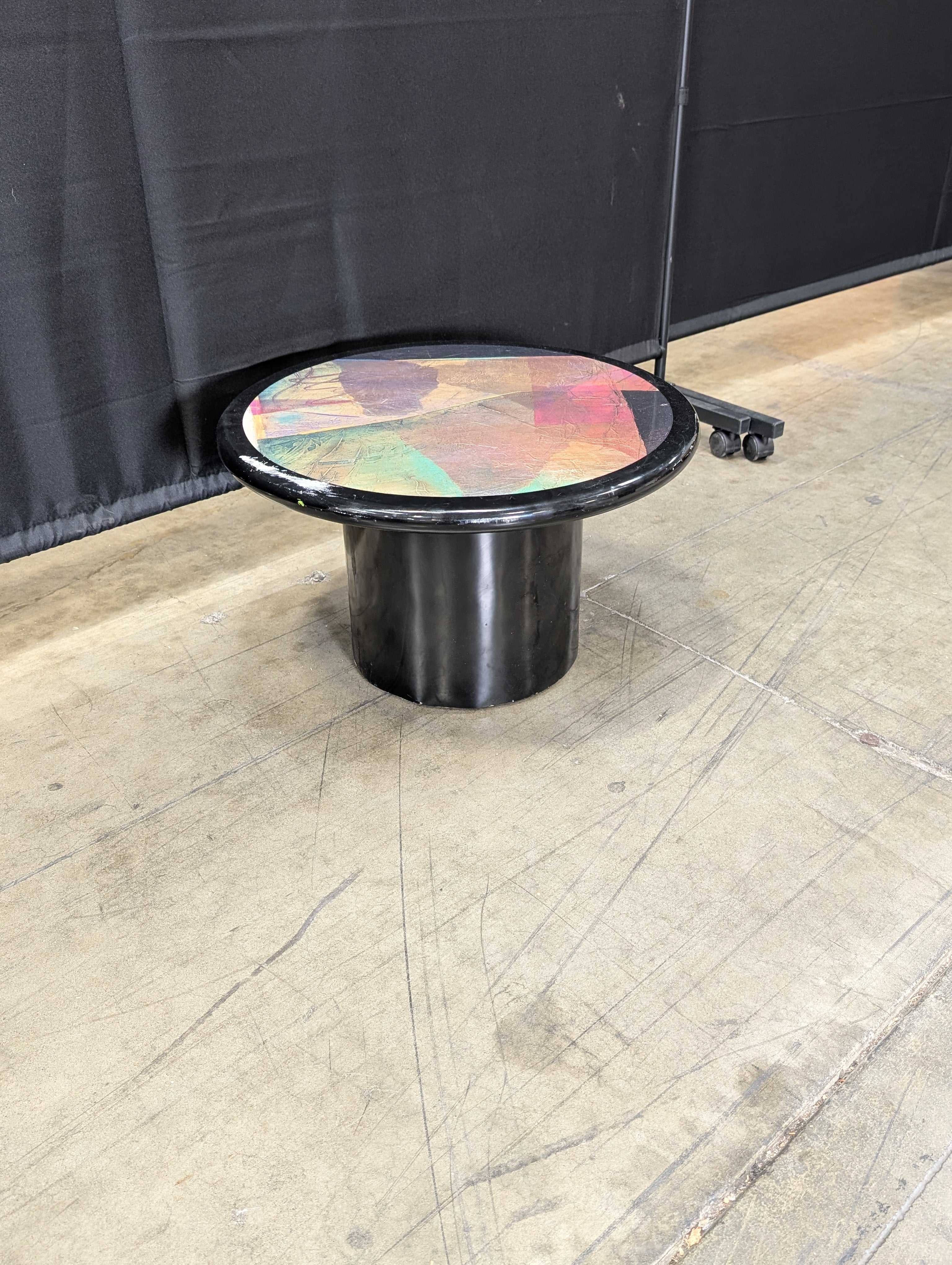Striking Round Pedestal Coffee Table with Iridescent Top