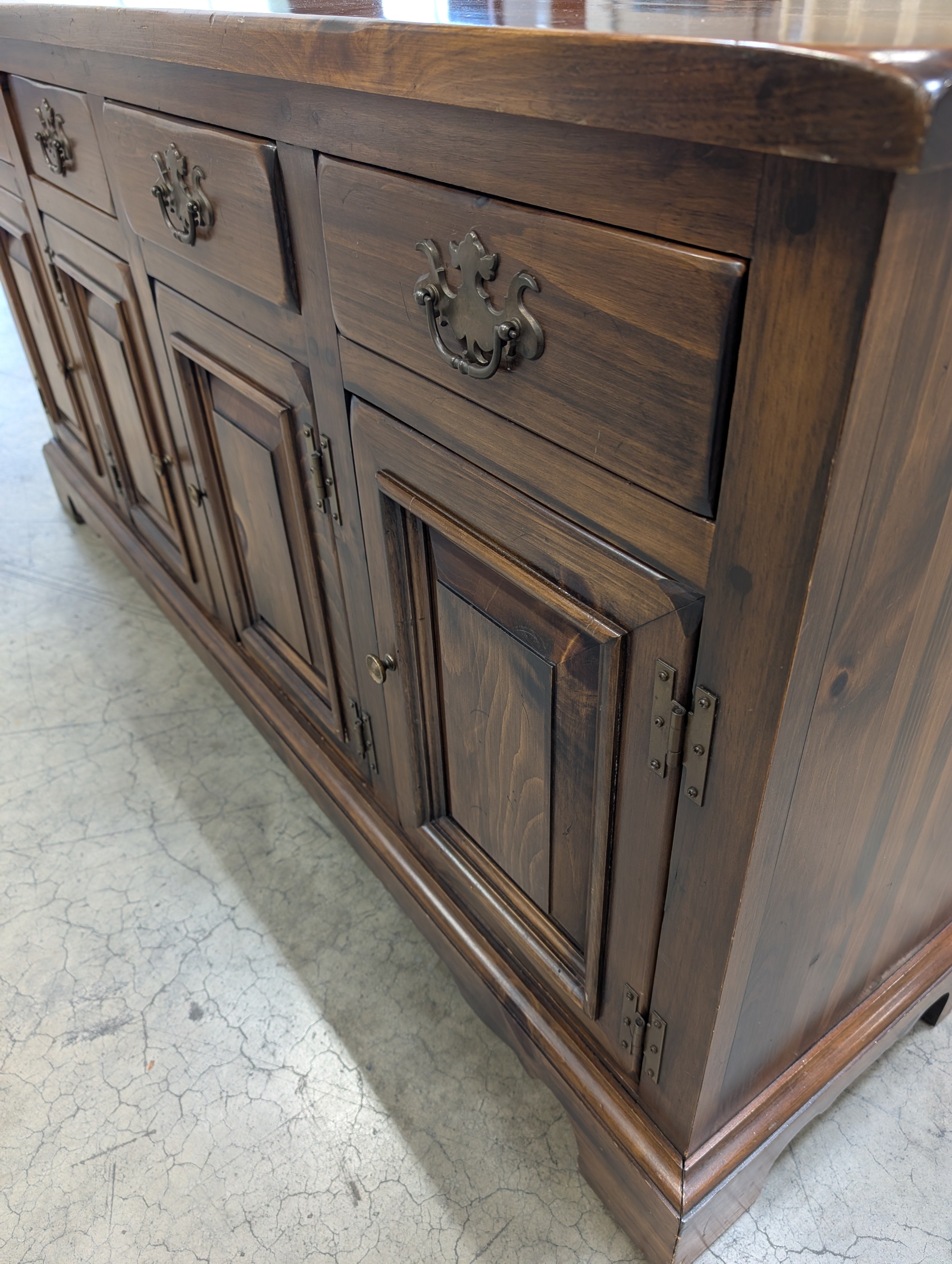 Rustic Dark Stained Wood Sideboard with Ornate Hardware