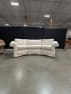 Has a stain Curved Cream Fabric Sectional Sofa with Rolled Arms