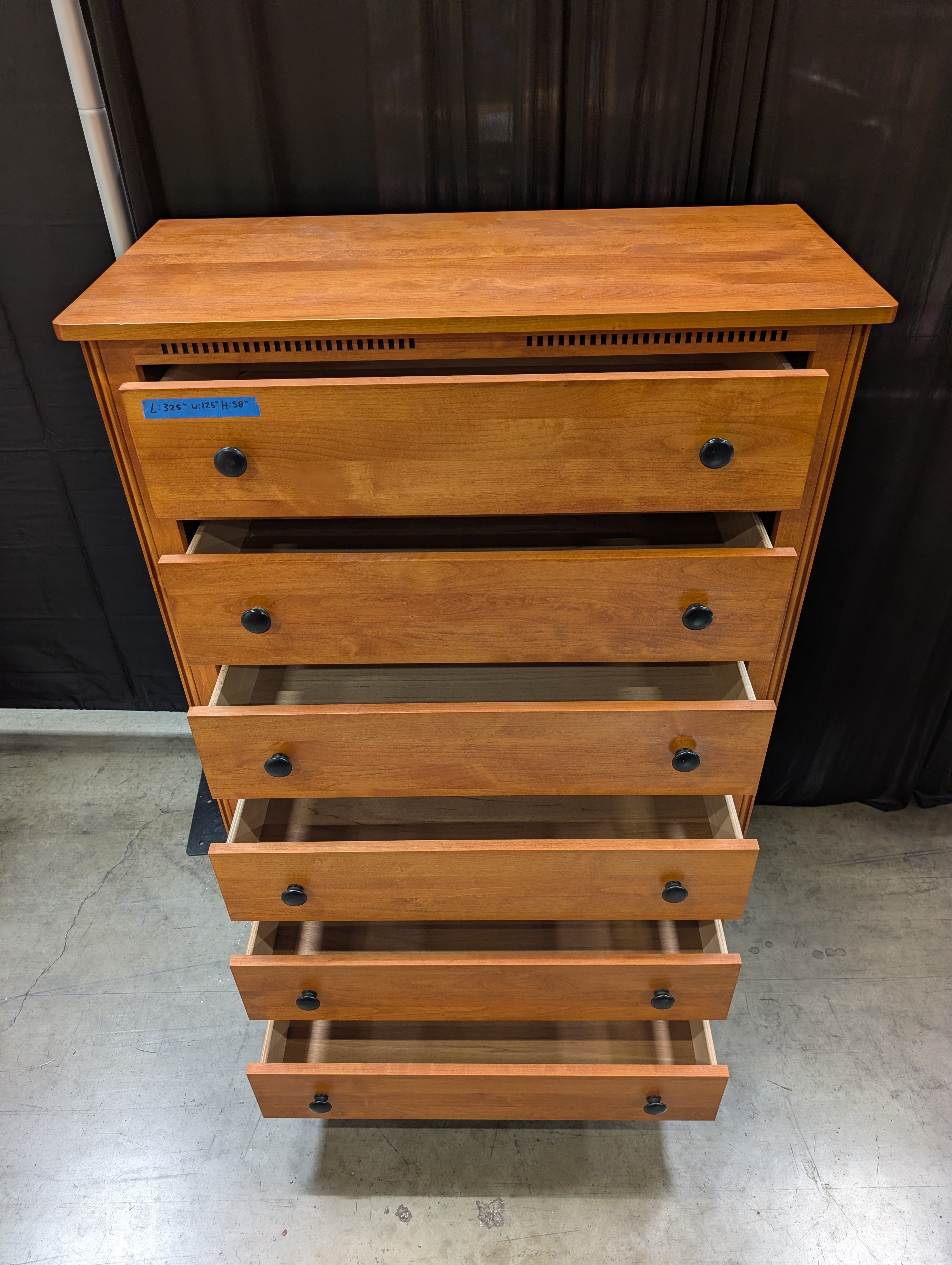 Warm Honey Wood Six-Drawer Dresser with Dark Knobs