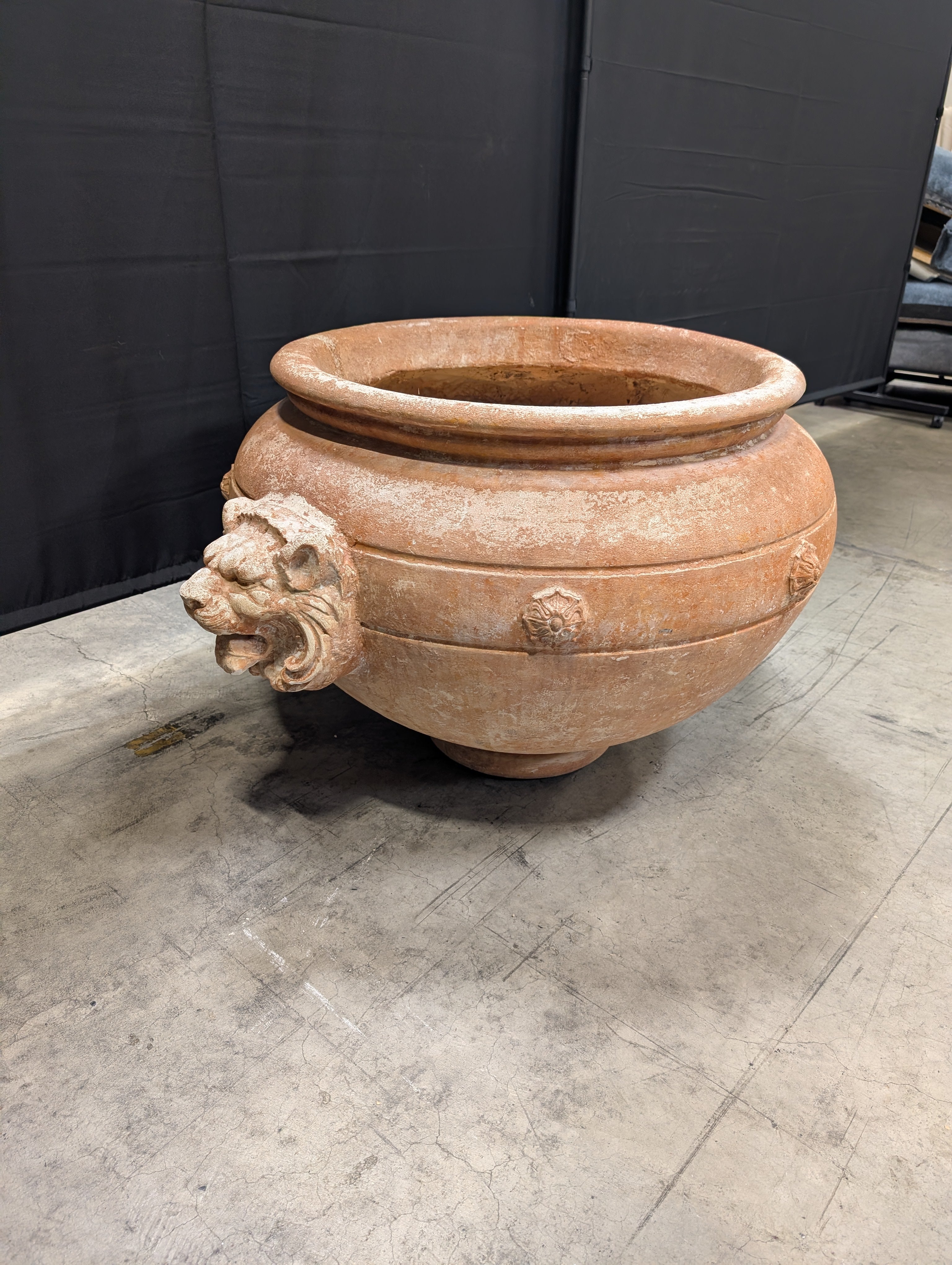 Ornate Terracotta-Style Planter with Lion Head Accents